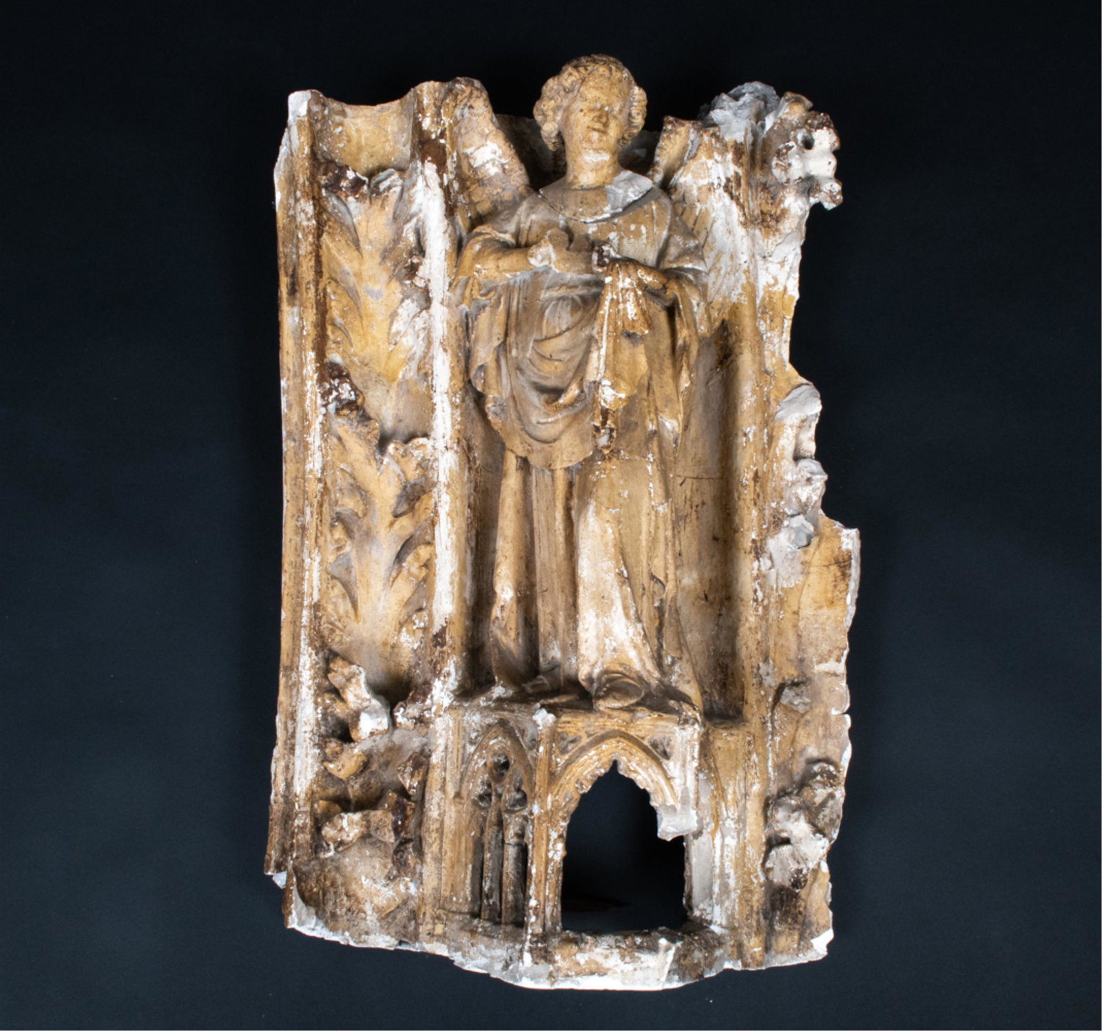 ATTR. VIOLLET-LE-DUC GOTHIC PLASTER CAST: Mid-19th century. Plaster cast of a gothic angel from an unknown facade. Reminiscent of the angel from Reims. Dimensions: H 34" x W 23" x D 11" Condition: Numerous losses, some repairs. Surface rubbin