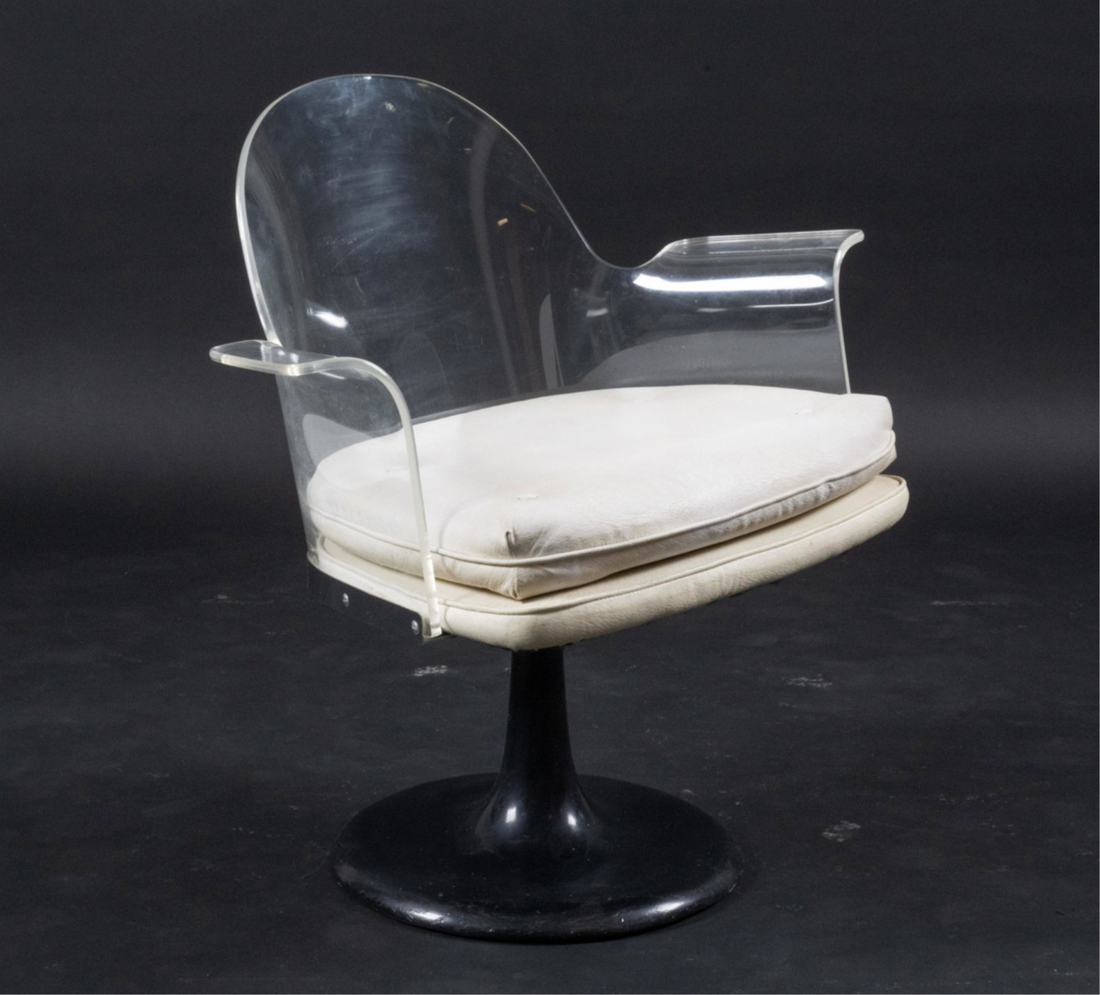 MANNER OF LAVERNE LUCITE SWIVEL CHAIR, C. 1970S: Modern c. 1970's sculptural lucite swivel chair on tulip-style base. In the manner of Vladimir Kagan and Estelle Laverne. No apparent labels. Dimensions: H 30.75" x W 29.5" x D 22" x SH 18.5" Conditio