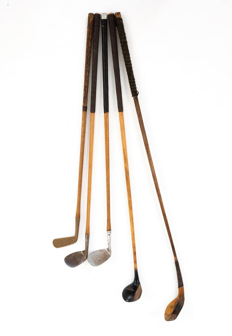 (5) VINTAGE WOODEN SHAFT GOLF CLUBS: (4) Marked Spalding Bros., (1) marked J. & D. Clark. Dimensions: (Longest) L 47" x W 5" x D 2.5" Condition: Great vintage/antique patina. Wear consistent with age and use.