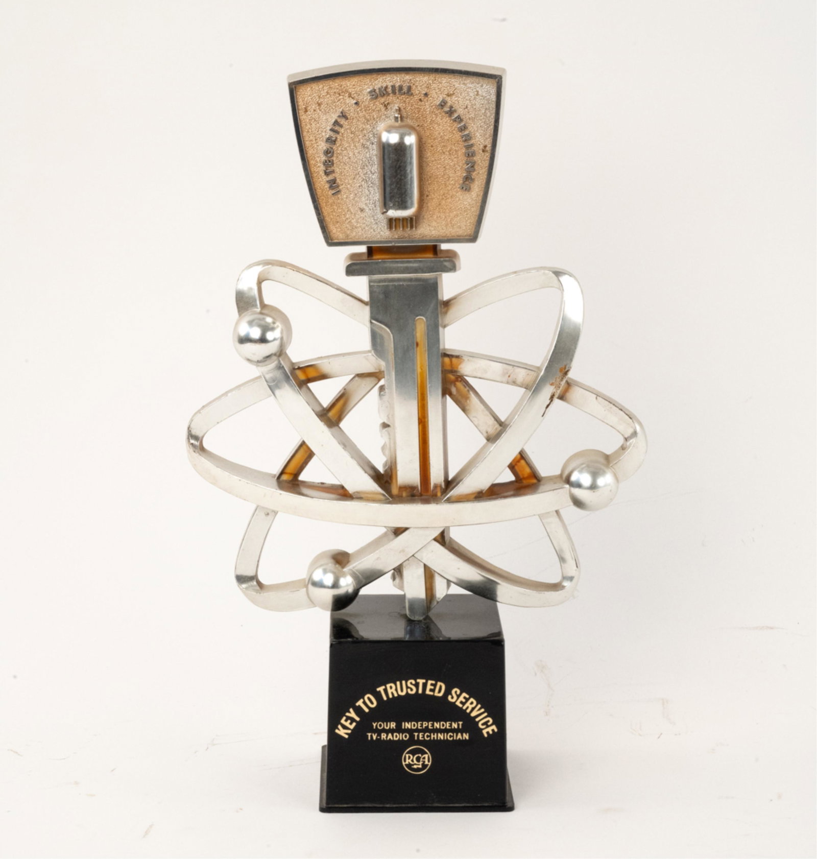 C. 1950 RCA RADIO SHOP COUNTER DISPLAY: A very interesting and highly unusual piece of RCA dealer memorabilia. Based on the atomic motif, the miniature tube type depicted and the meatball logo, we estimate this piece to be c. 1950. It is ma