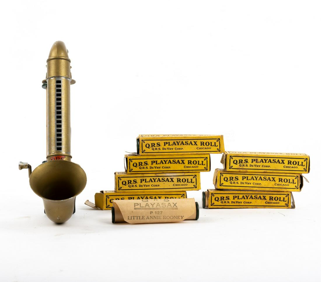 Q.R.S. PLAYASAX WITH MEDIA: This is an early music roll player that uses a blow-type action rather than a bellows to produce the air pressure. It is complete with several additional rolls of media and the takeup reel. Made of so