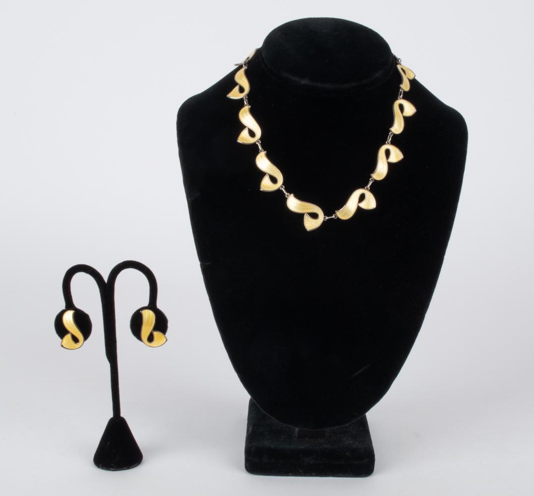 IVAR HOLTH NORWAY RETRO SILVER & ENAMEL SUITE: Norwegian Modern jewelry suite by Ivar T. Holth, consisting of a pair of ear clips and choker-length necklace in gold-washed sterling silver and yellow enamel, with abstract ribbon motif. Each piece s