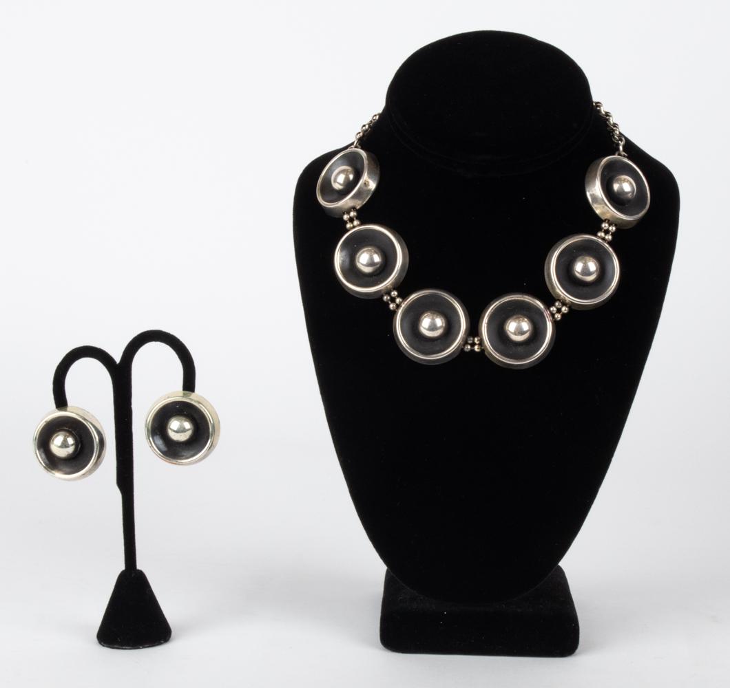 FRANCISCO REBAJES MODERNIST JEWELRY SUITE: Modernist jewelry suite by Francisco Rebajes, consisting of a pair of ear clips and statement necklace in silver-plated copper, with partially-blackened finish. Each piece signed Rebajes. Dimensions: