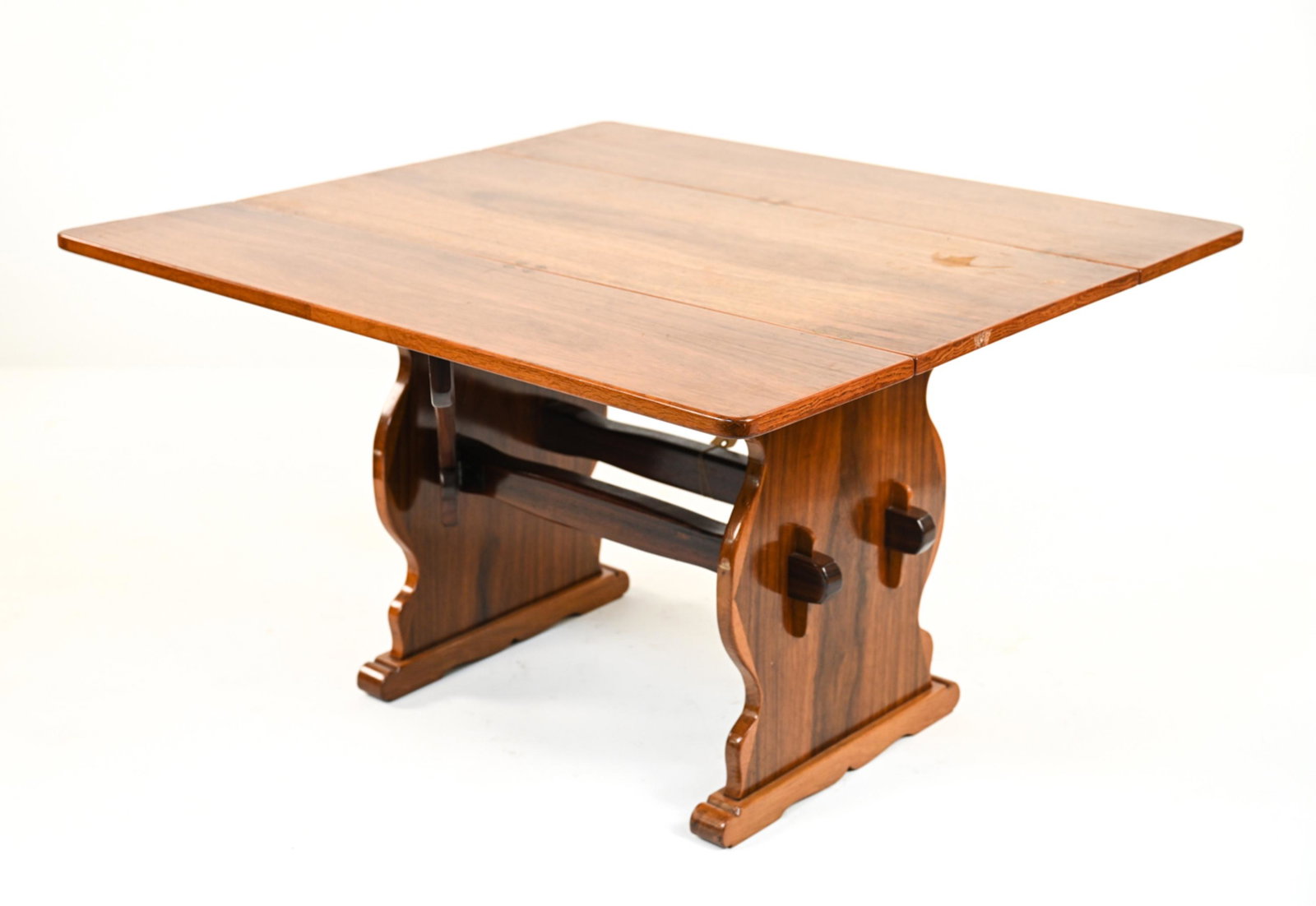 DANISH ROSEWOOD DROP LEAF TABLE: Danish teak and rosewood drop leaf table. Dimensions: (leaves open) H 28" x W 47.5" x D 44.5" (leaves closed: H 28" x W 22" x D 44.5" Condition: Top surface has 3 small blemishes or divots to the fini