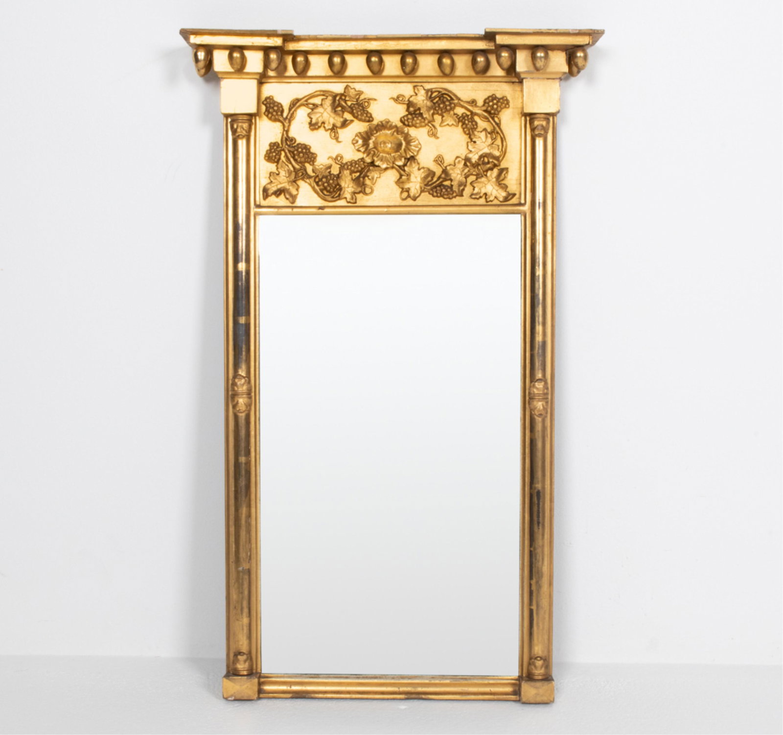 ANTIQUE CARVED GILTWOOD MIRROR, AS-IS: Dimensions: H 37.5" x W 23" Condition: As-is; several repaired breaks and cracks to carving and frame; joint separation, cracks, losses to gilding, some de-silvering to mirror.