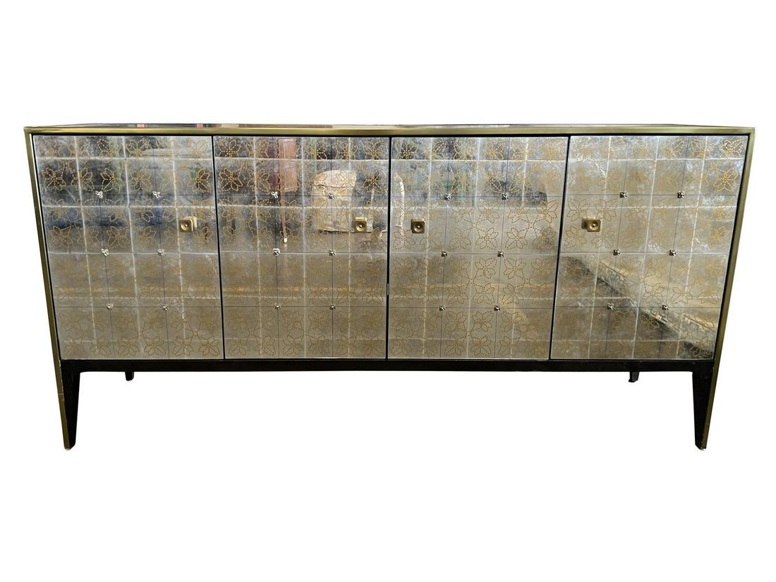 ARHAUS MIRRORED & GOLD FLORAL DETAIL CREDENZA: This credenza has a mirrored front with a gold floral pattern on the doors and brass pulls. The shelves are adjustable. Lovely for an eclectic interior. Dimensions: H 31.5" x W 65" x D 18" Condition: 