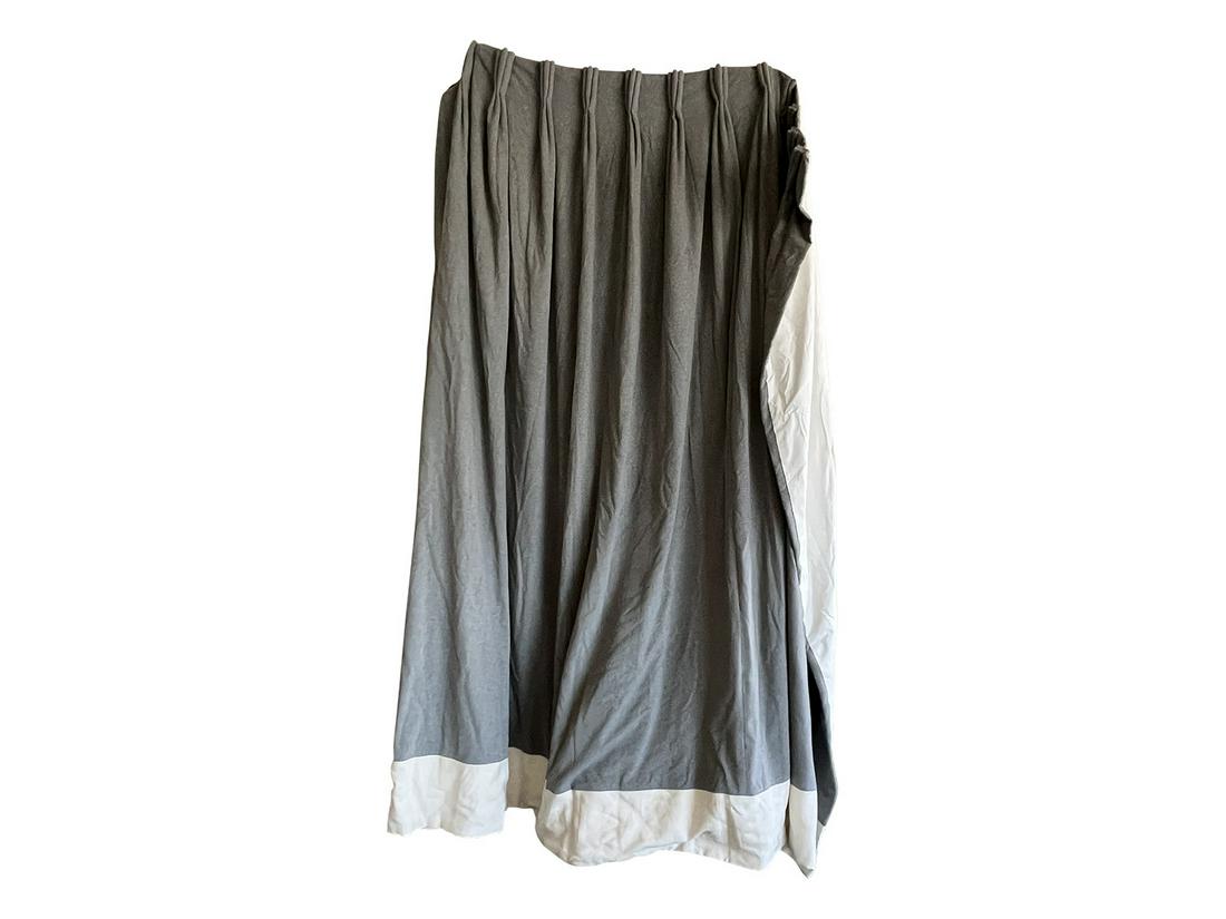 PAIR OF GRAY ITALAN WOOL CURTAIN PANELS: A handsome pair of grey Italian wool flannel curtain panels, featuring an off white linen border and pinch pleat detail. Fully lined. Dimensions: H 105" x W 86" Condition: Drapery hardware not include
