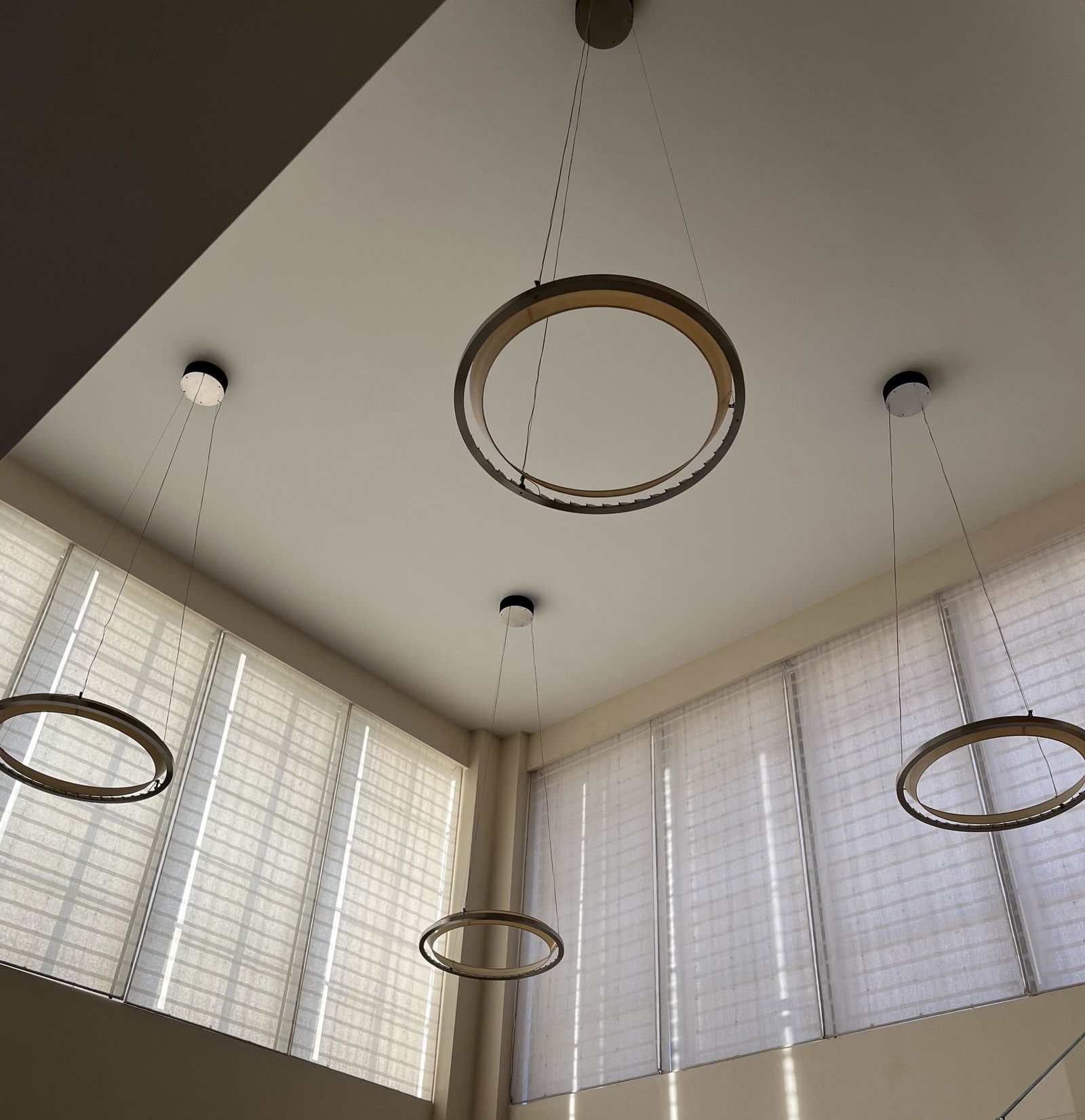 (4) 'NIMBA' PENDANT LIGHTS BY ANTONI AROLA: Four modernist Santa & Cole 'Nimba' hanging pendant lights designed by Antoni Arola. The 34" size retails for about $7,540. each. Dimensions: Dia. 34" Condition: Minor surface wear consistent with age