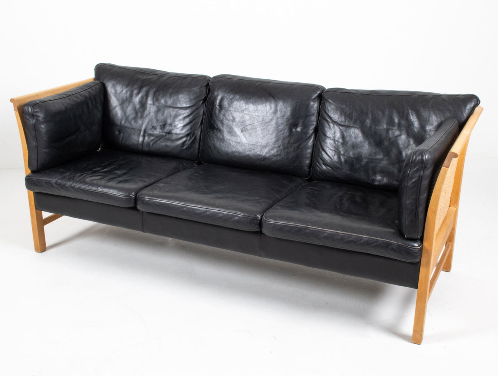 BEECH & RATTAN ARNE VODDER STYLE SOFA: Danish Mid-Century Modern sofa. Leather, beech and rattan. Dimensions: H 33" x W 78" x D 34.5" x SH 17.5" Condition: Minor surface wear, marks and scuffs consistent with age and use. Some wear to pipi