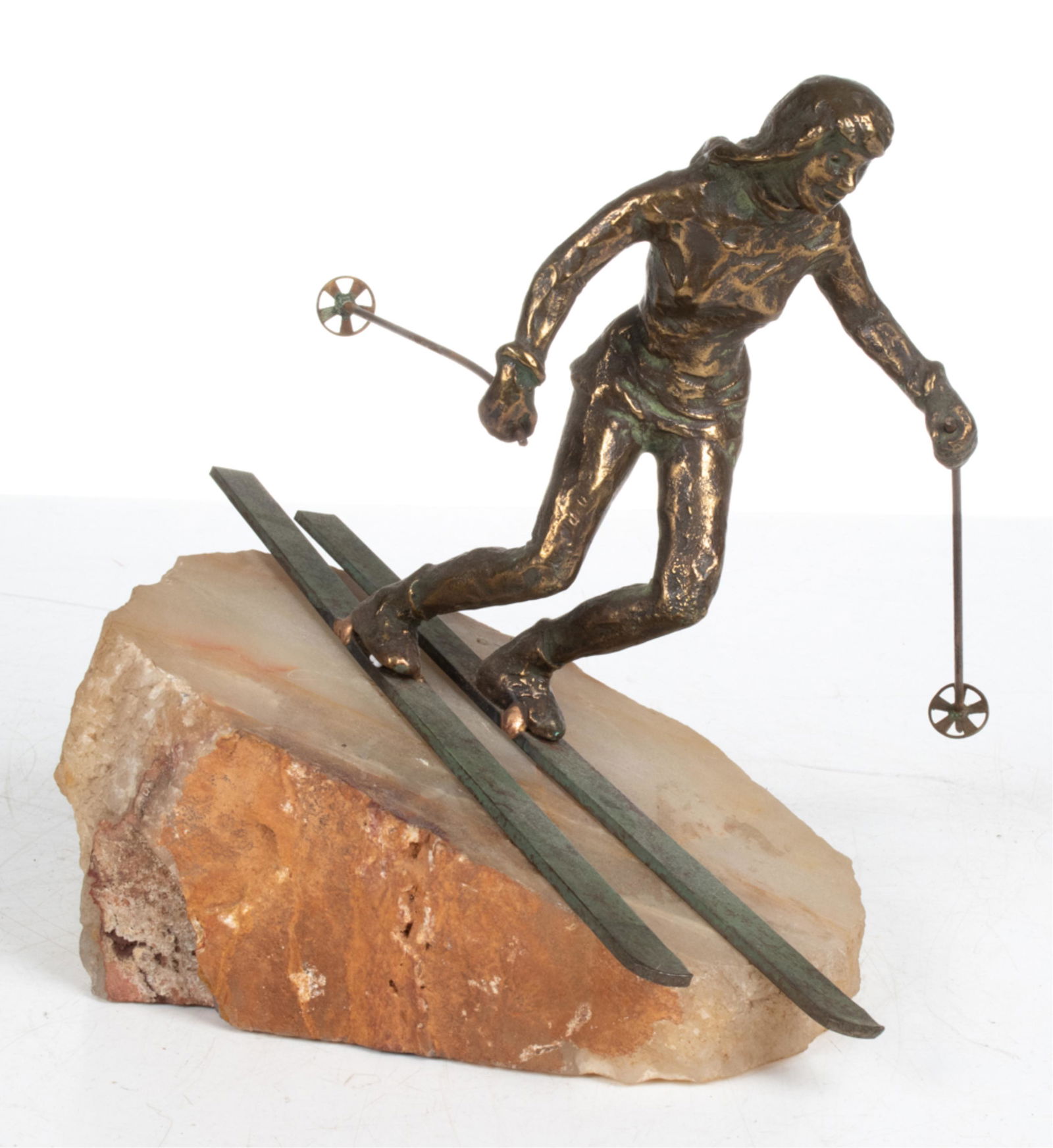 CURTIS JERE BRONZE & ONYX SCULPTURE OF A SKIER: Signed C. Jere on left ski, with original Curtis Jere LA label under base, c. 1970's. Dimensions: (Incl. base) H 9.25" x W 10.5" x D 6" Condition: Possible small weld repairs to feet; natural patinati