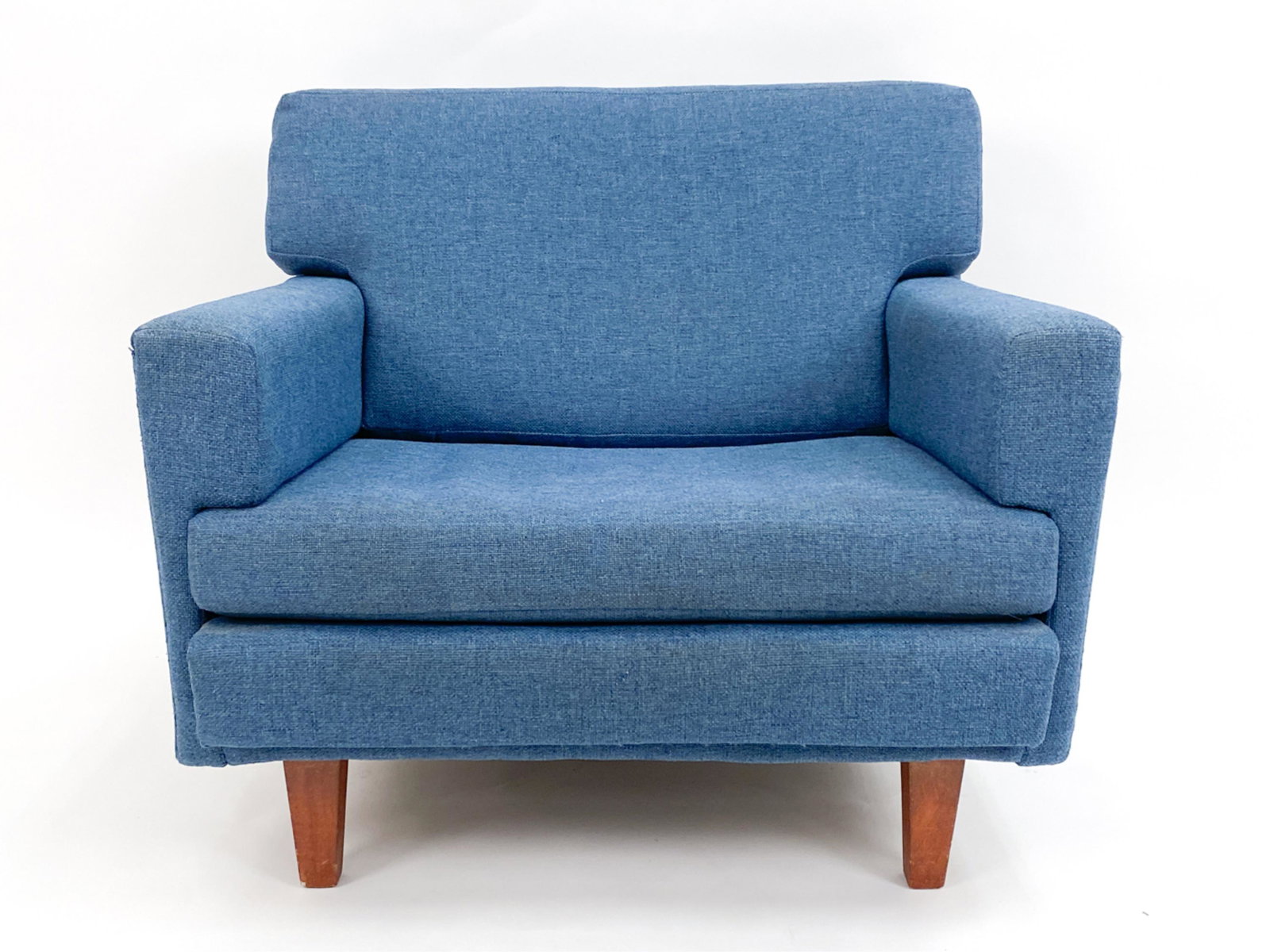 VINTAGE MODERN LOUNGE ARM CHAIR: Upholstered vintage modern accent chair, walnut legs. Dimensions: H 27" x W 32.5" x D 30" x SH 15.5" Condition: Minor surface wear consistent with age and use. Paint splatter to back edge, dust. Uphol