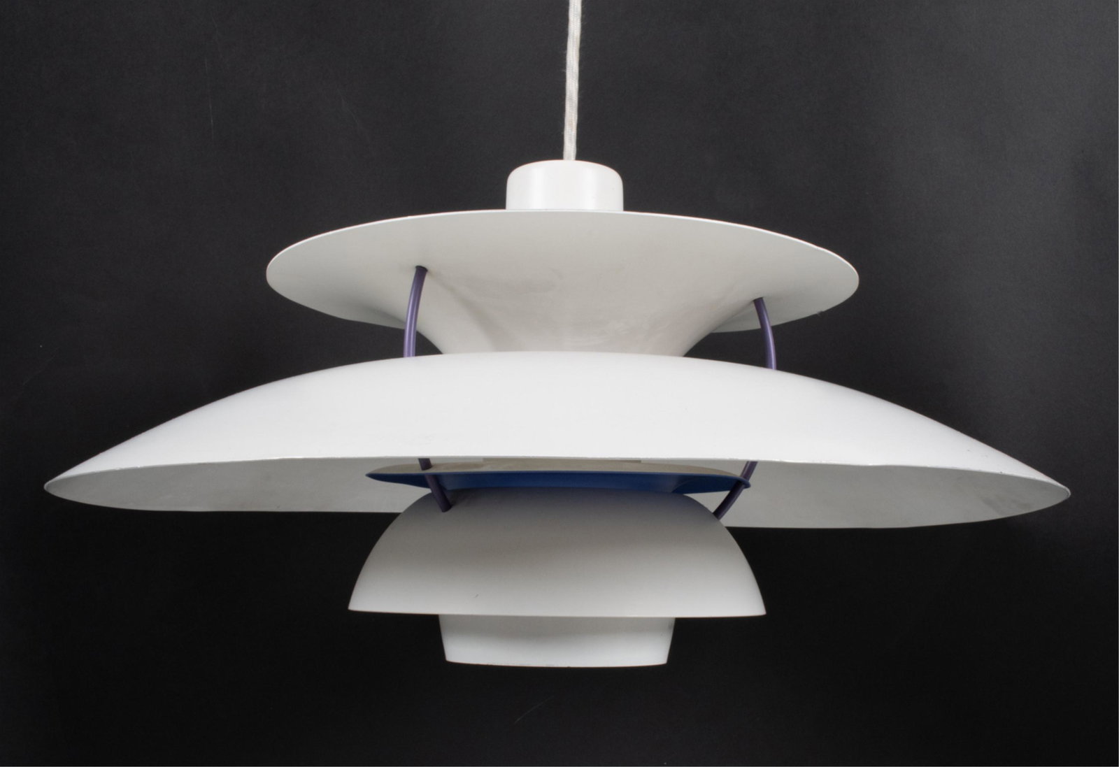 POUL HENNINGSEN FOR LOUIS POULSEN PH5 PENDANT: Iconic PH 5 pendant in white enameled metal with purple, blue and red accents. C. Mid- to Late 20th Century. Dimensions: H 11" x Dia. 19" Condition: Wiring not tested. Bends to shades. Scattered scuff