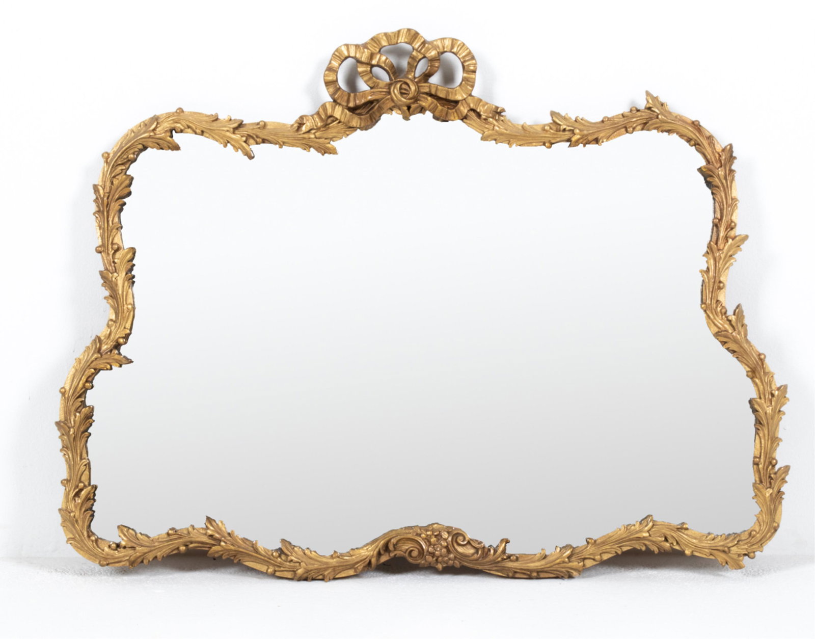 ANTIQUE CARVED GILTWOOD & GESSO MIRROR: C. Late 19th-Early 20th Century. Dimensions: H 29" x W 37.5" Condition: Frame apparently refinished in gold paint. Carving with several cracks; a few nicks, possible small repairs. A few small spots o