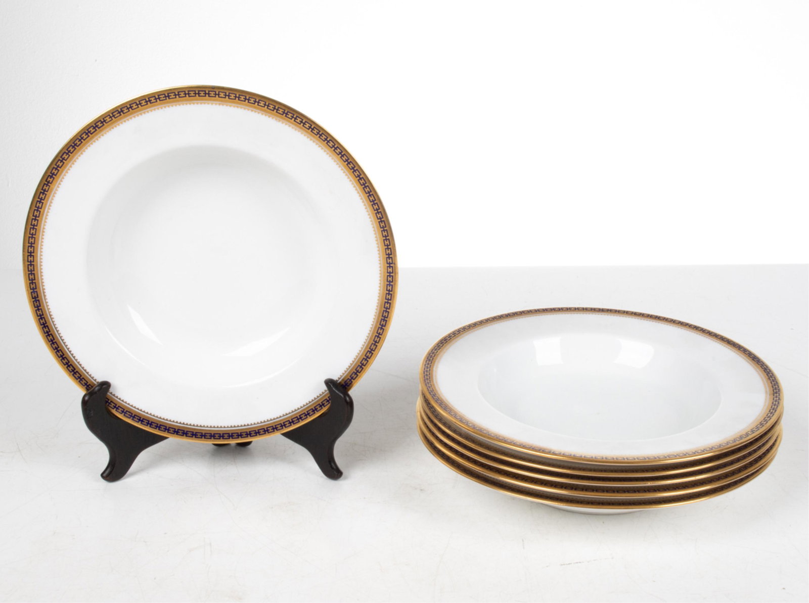 SET OF (6) SPODE CHINA "MAJESTIC" SOUP BOWLS: Set of (6) Hollywood Regency revival soup bowls from the "Majestic" pattern by Spode, with cobalt chain motif on gold gilt trim. Signed "Spode / Copeland's China" with retailer's mark "Davis Collamore