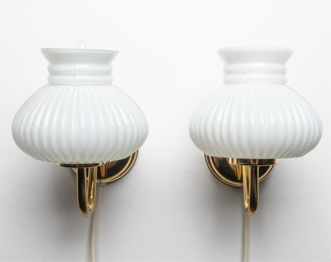(2) DANISH ABO RANDERS CASED GLASS & BRASS SCONCES: Labeled ABO Randers on wall canopy, c. 1970's. Dimensions: H 8" x W 6" x D 7.5" Condition: Wiring not tested; currently wired with European plugs. A few tiny pits and scuffs to brass. B085-K