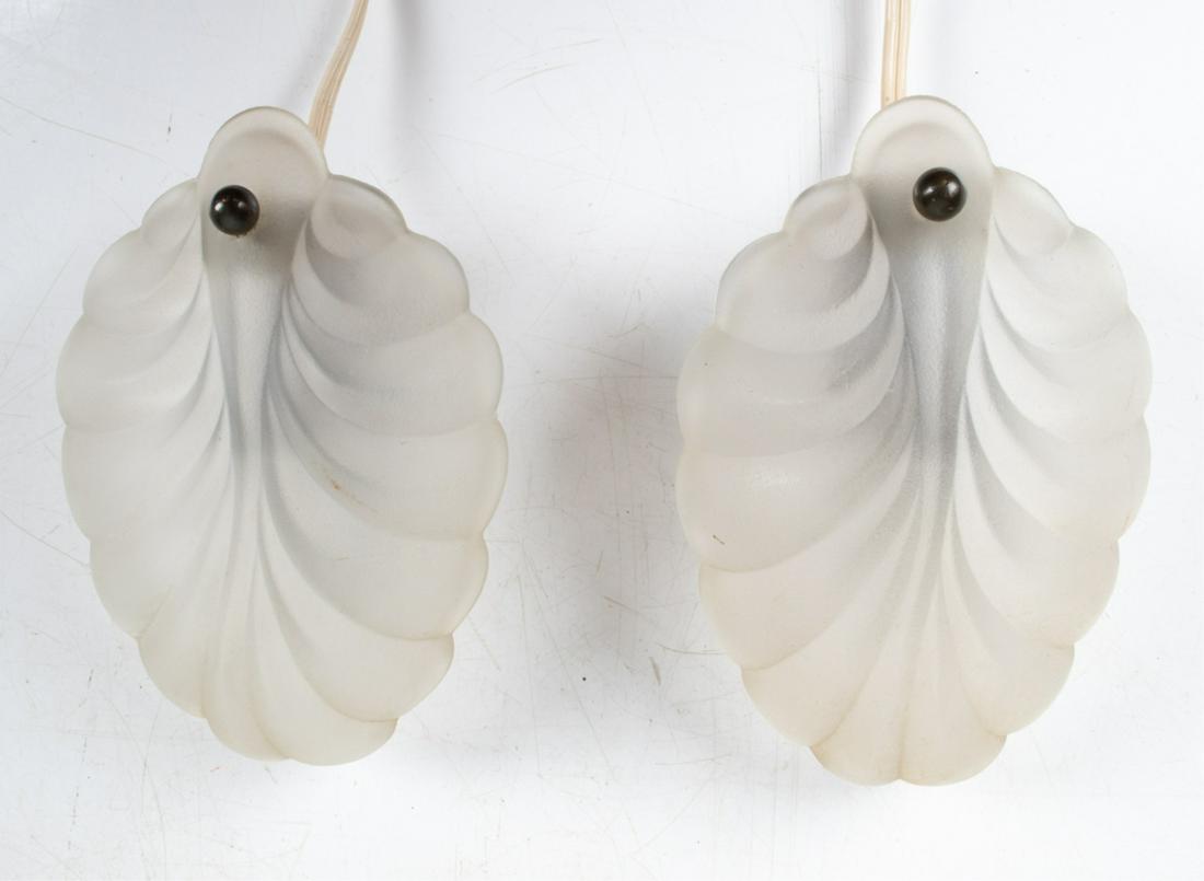 PAIR OF DIMINUTIVE SCONCES; STYLE OF FAGERLUND: Pair of petite sconces with frosted glass leaf shades, in the manner of Carl Fagerlund for Lyfa. Made in Denmark, c. 1950's. Dimensions: H 6" x W 4" x D 3" Condition: Wiring not tested. Small internal