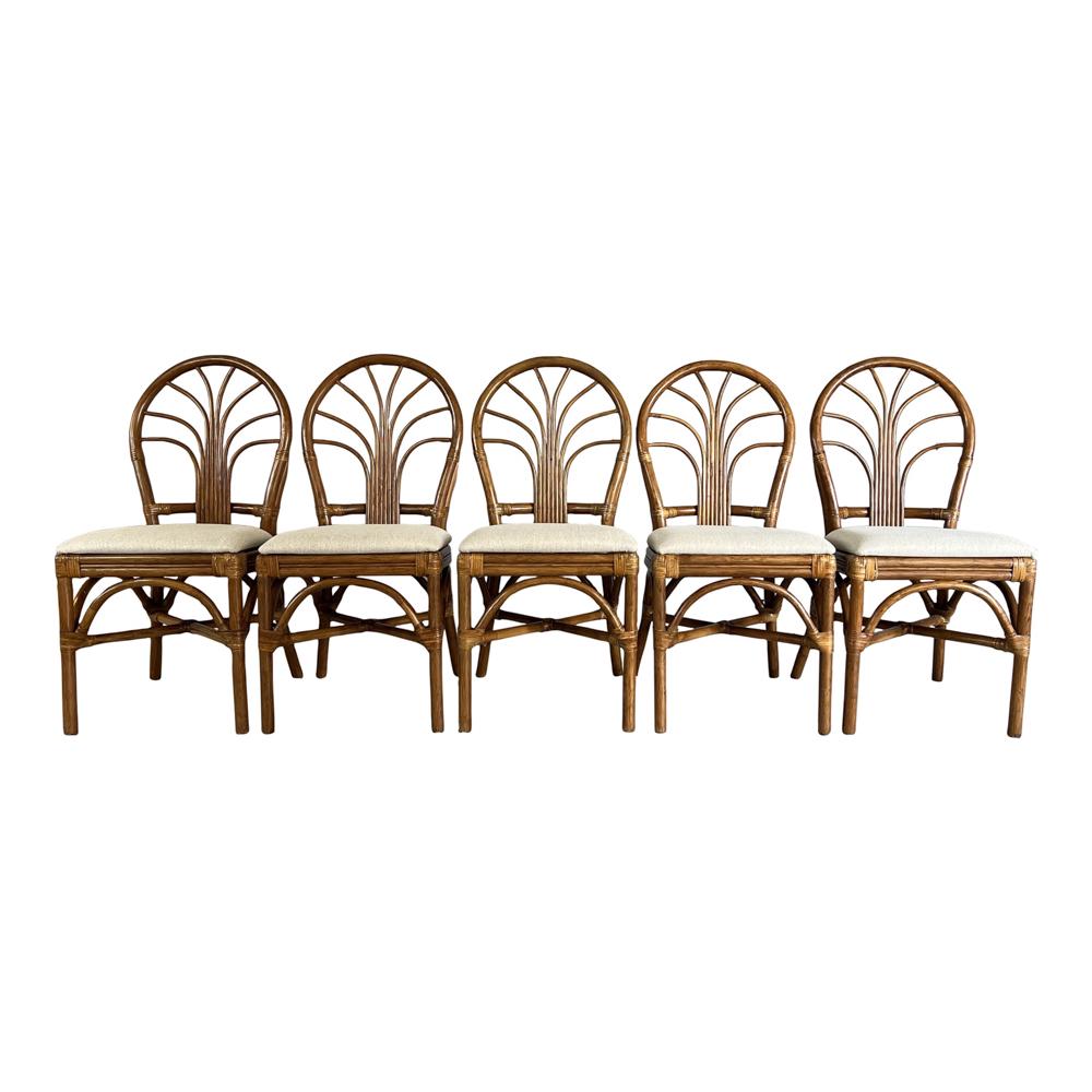 (5) MID-CENTURY TIKI PALM BEACH-STYLE CHAIRS: Distinctive set of five Mid-Century Modern bamboo dining with oval backs. Masterfully upholstered in stylish ivory fabric. These chairs feature a quality dark bamboo frame with lovely upholstered seat