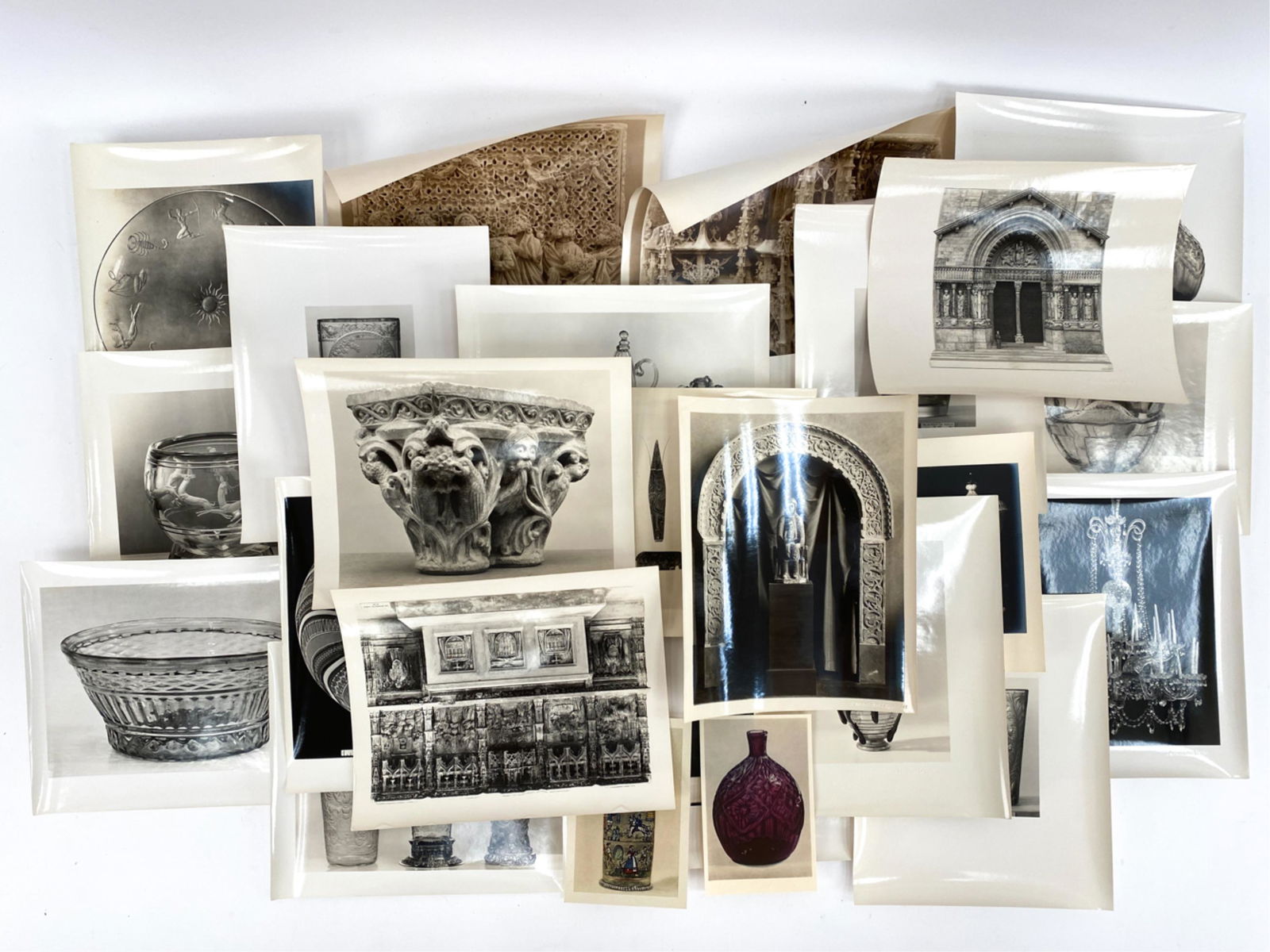 GROUPING OF BLACK & WHITE MUSEUM PHOTOGRAPHS: Photographs of objects. Many with descriptions on back. One group in envelope stating Metropolitan Museum of Art. Dimensions: (Envelope) H 12" x W 10" Condition: Used, worn, some curling.