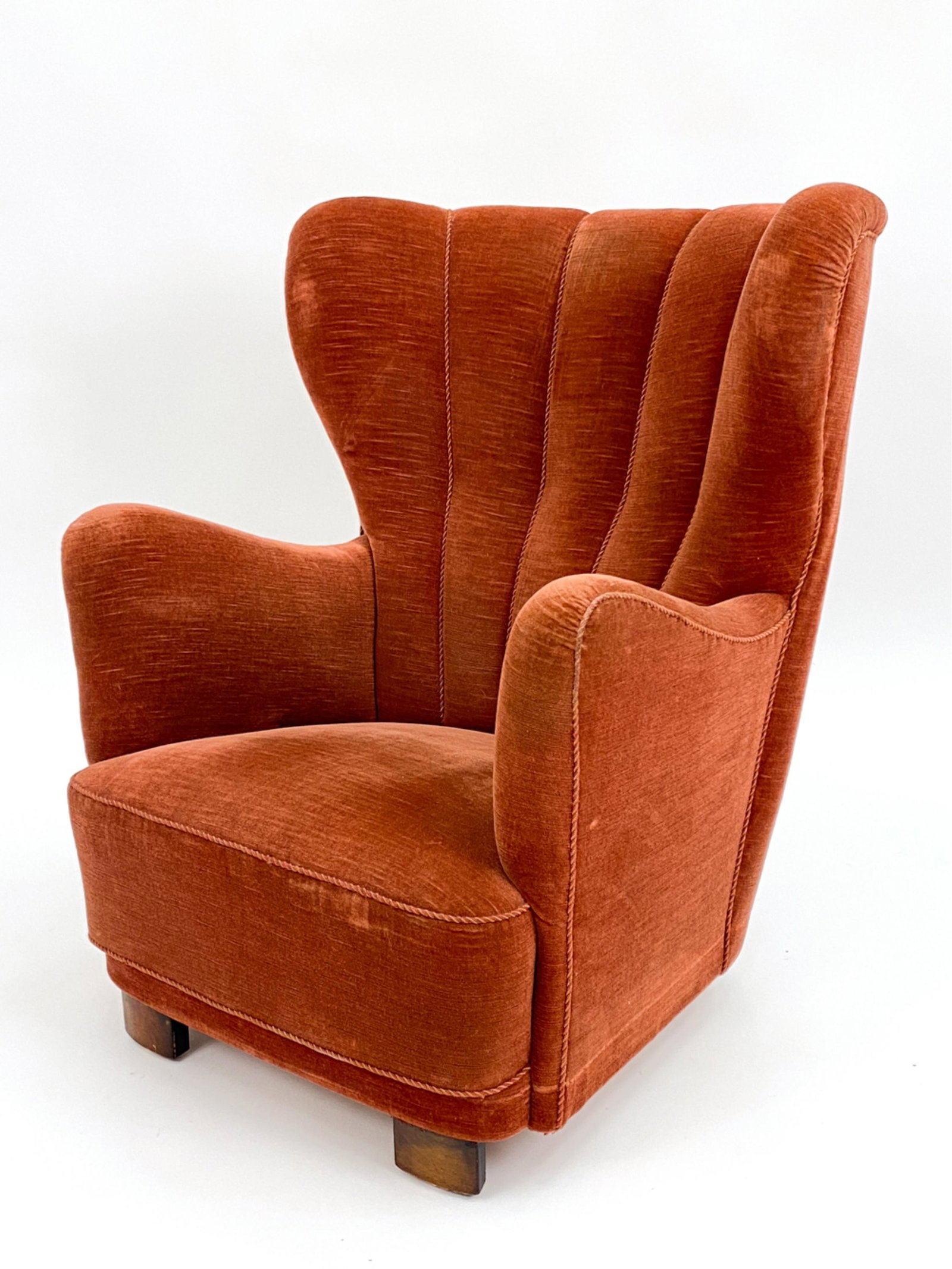 SLAGELSE MOBELVAERK DANISH EASY CHAIR: Danish, 20th century. Wingback easy chair in brick red mohair with channeled piping. By Slagelse Mobelvaerk, unsigned. c. 1940's. Dimensions: H 38.5" x W 32.5" x D 34" x SH 15" Condition: Showing norm