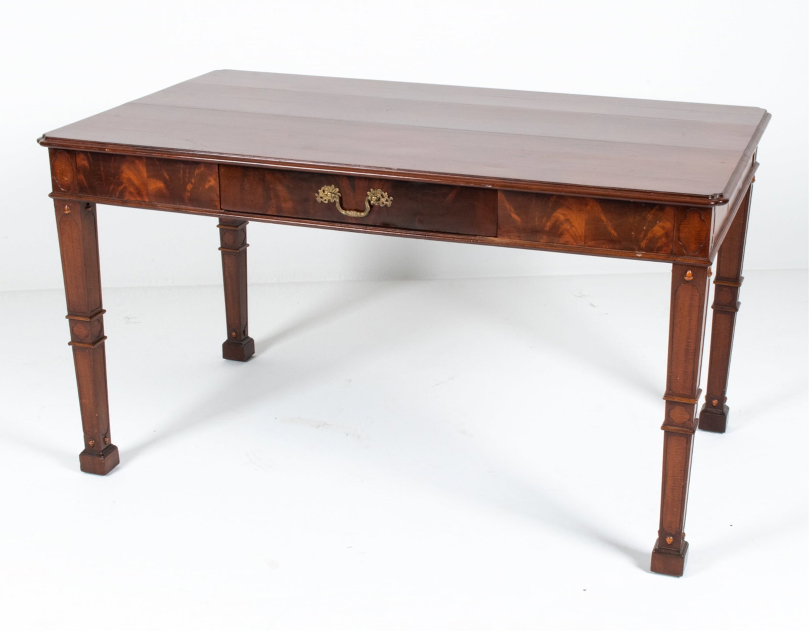 FLAME MAHOGANY WRITING DESK: With one dovetailed drawer. Dimensions: H 30" x W 54" x D 32.5" Condition: A few small splits and nicks to veneers, a few minor gouges to top. Nicks and dings to legs. Wear consistent with age and use