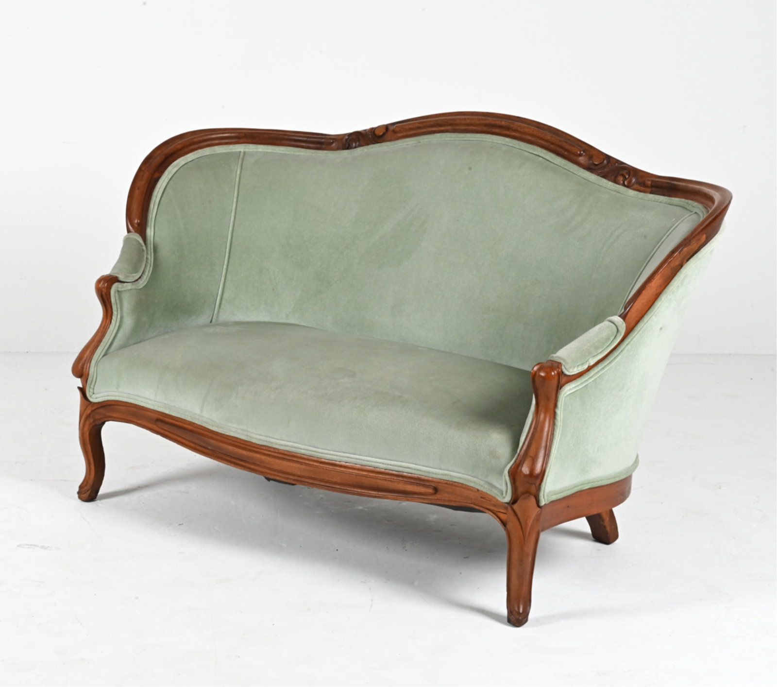 ANTIQUE VELVET CANAPE SETTEE: Dimensions: H 33.25" x W 55.5" x D 19" x SH 13.5" Condition: Wood refinished; repaired cracks to back rail and apron; scattered nicks and dings. Spots of soiling, a few spots of balding to velvet pile