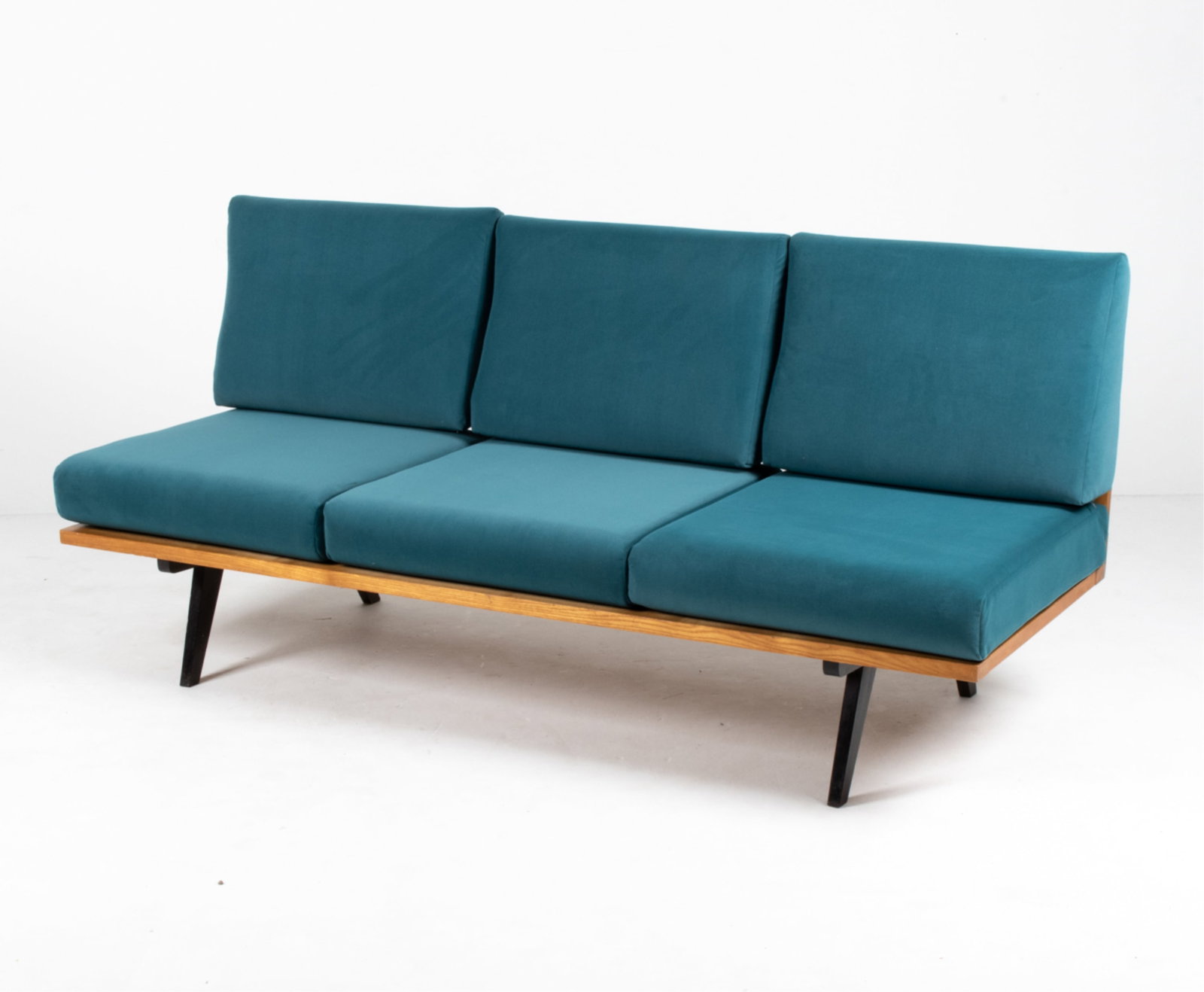 MID-CENTURY OAK DAYBED OR BANQUETTE SOFA: Velvet cushions. Dimensions: H 35" x W 75.75" x D 31.5" x SH 17" Condition: Nicks and dings; a few water spots to frame. Sun fading and a few spots of soiling to cushions. PA048