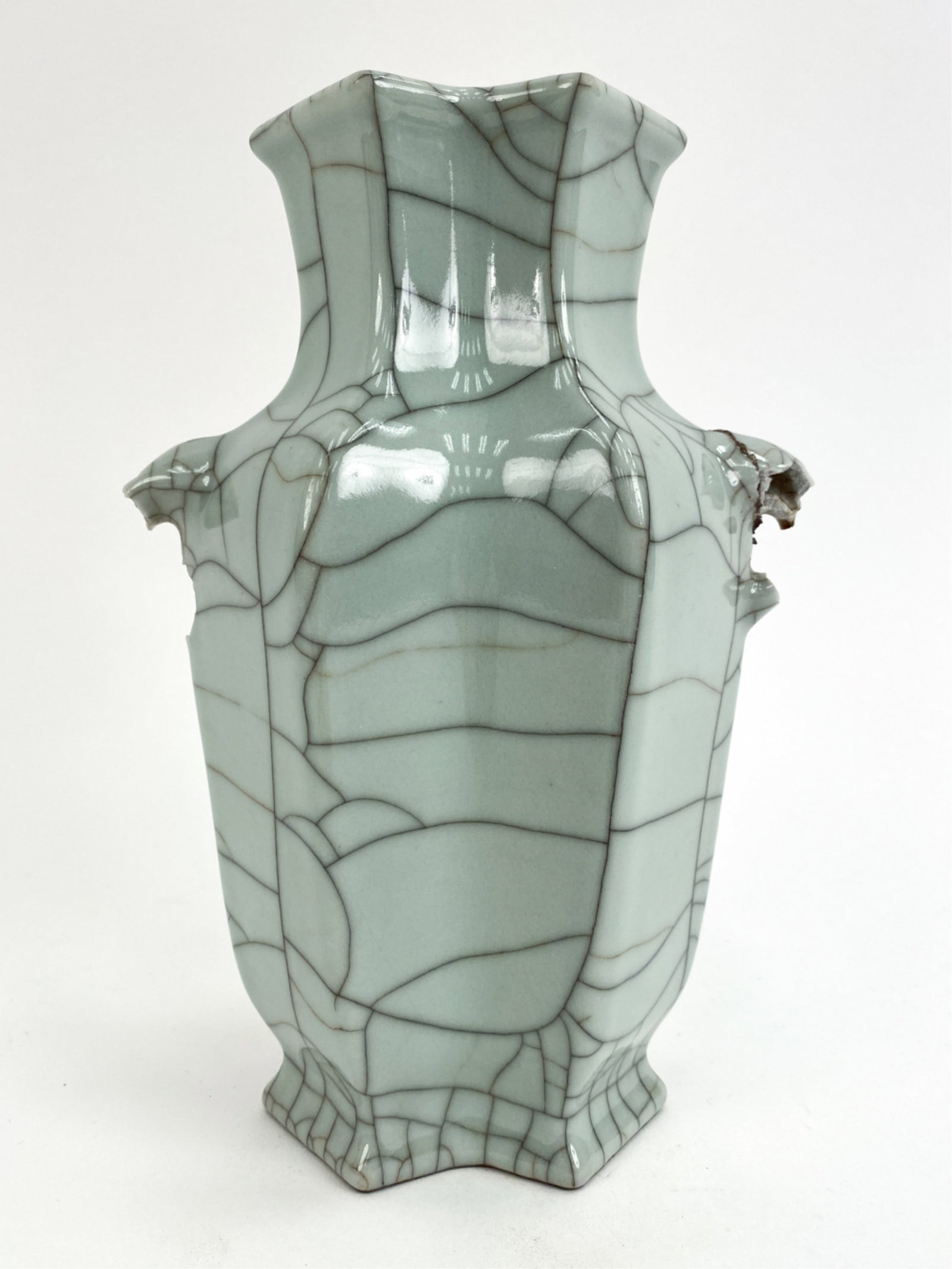 CHINESE CELADON CRACKLE GLAZE VASE: Stamped on bottom. Dimensions: H 8.25" x W 6" x D 3.5" Condition: Losses to handles.
