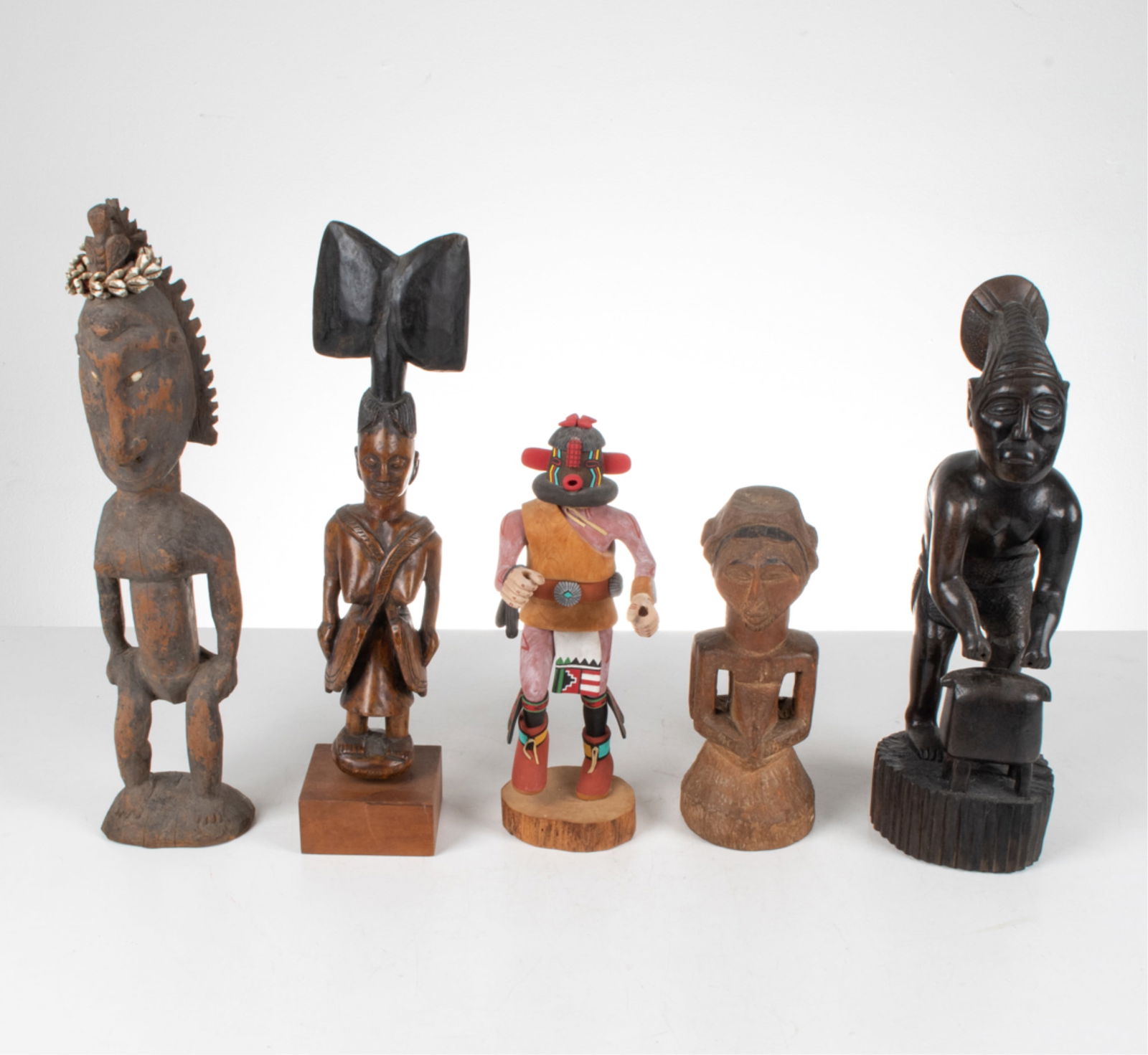 (5) TRIBAL SCULPTURES INCL. PAPUA NEW GUINEA: Dimensions: (Largest) H 21" x W 4.25" x D 4" Condition: A few stress cracks on some of the sculptures. But in overall good condition to all 5 of the sculptures.