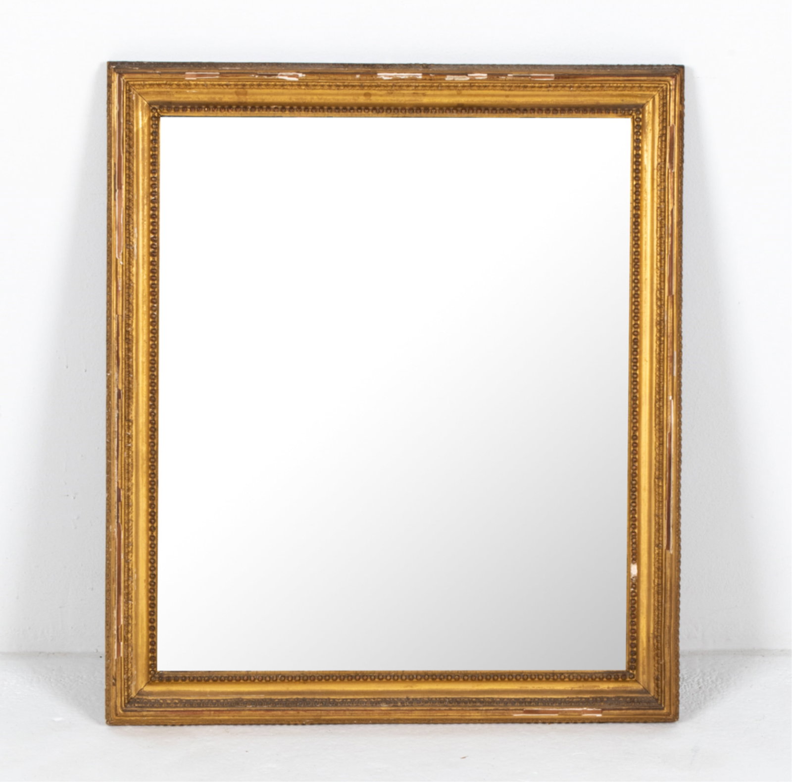 ANTIQUE GILTWOOD & GESSO WALL MIRROR: Dimensions: H 35" x W 26" x D 1.75" Condition: Showing signs of wear including chips and losses to gilt frame.