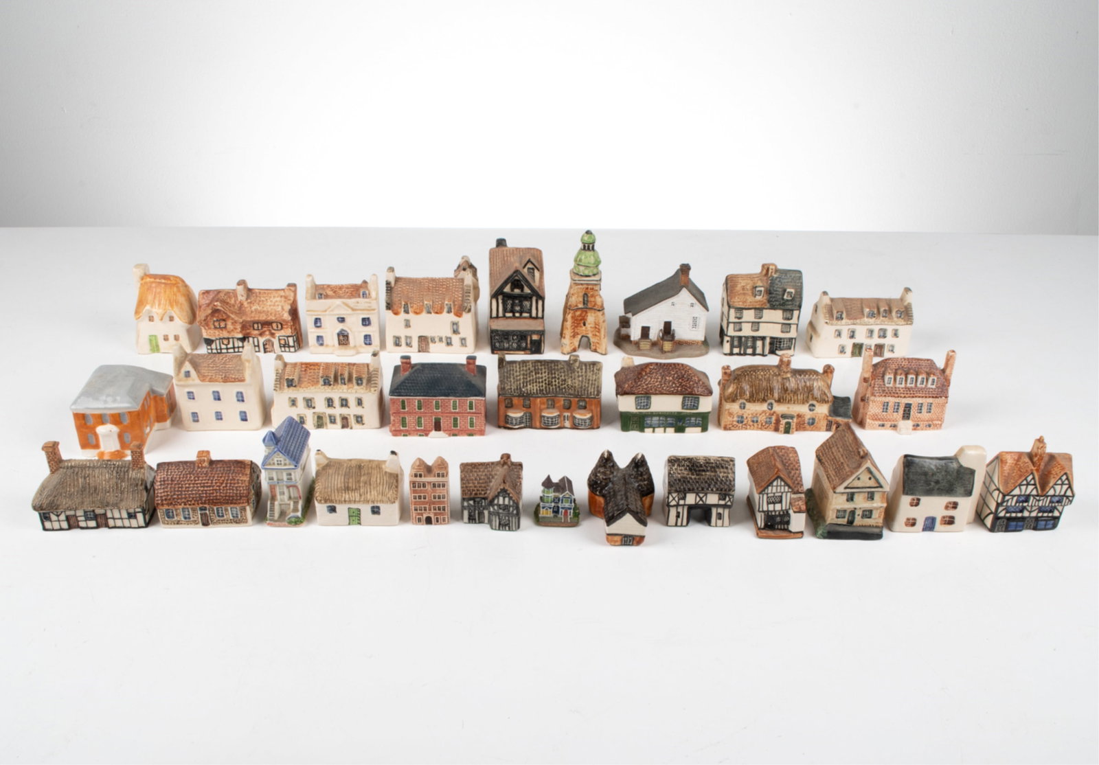 GROUPING OF PORCELAIN MINIATURE BUILDINGS (1 of 20)