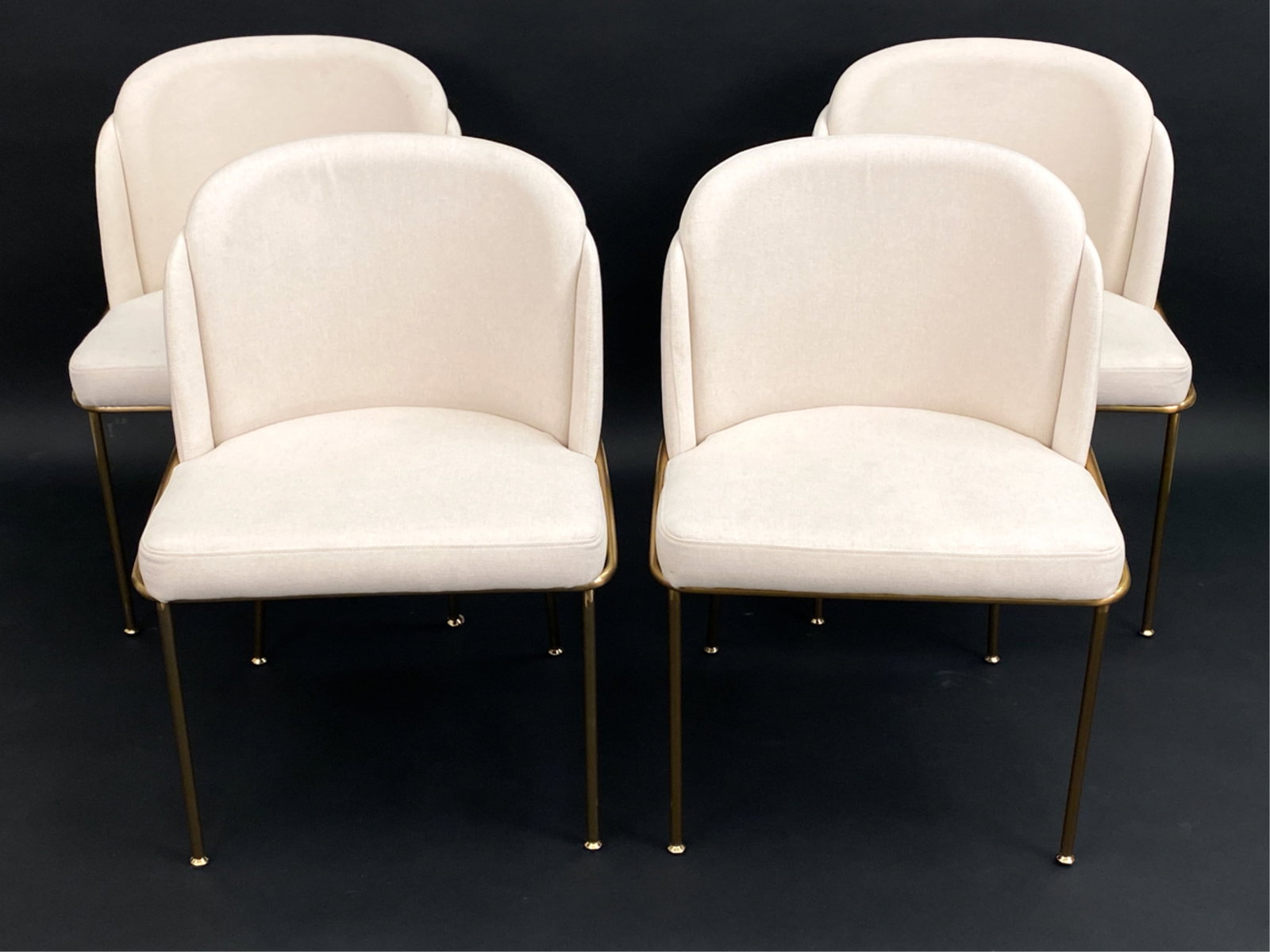 (4) ROVE CONCEPTS DINING CHAIRS: Set of four Rove Concepts dining chairs. Features brass metal legs, high density foam seats. Dimensions: H 31.50" x W 22.5" x D 22.5" x SH 18" Condition: Very minor surface wear, scuffs, marks and scr