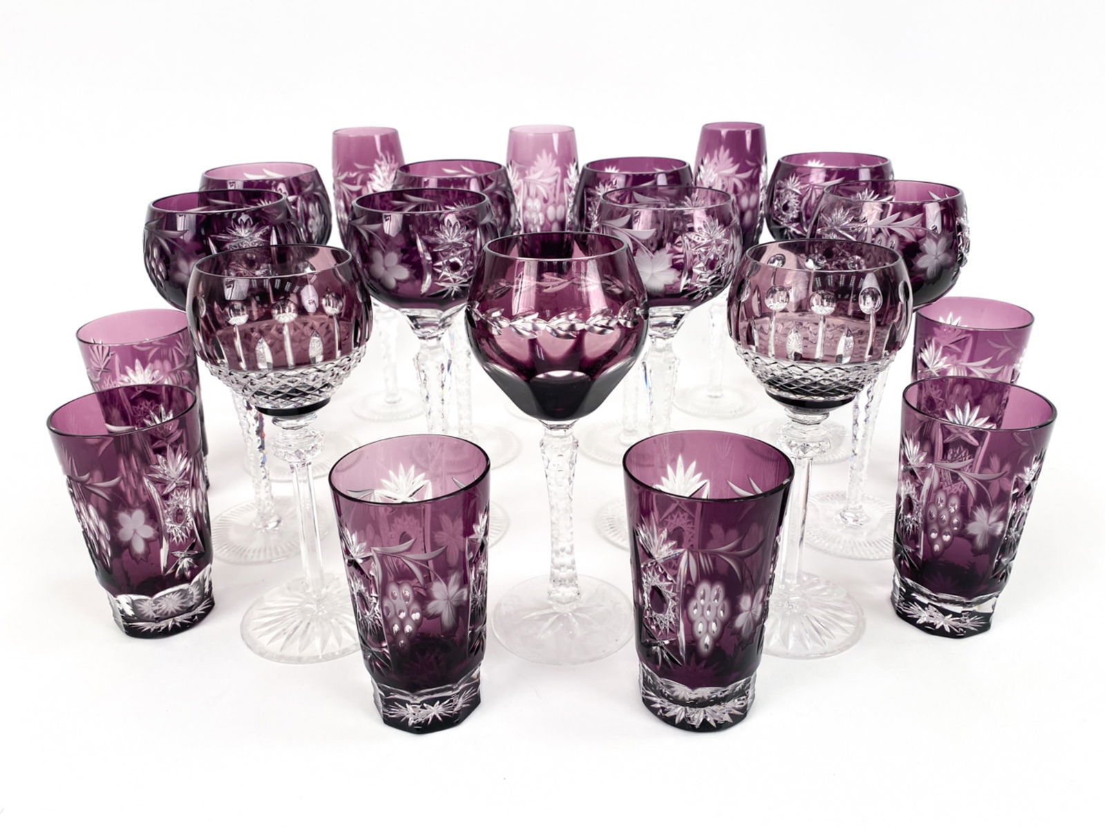 GROUPING OF LAVENDER CUT-TO-CLEAR GLASSWARE: Including (11) wine, (3) flutes, (8) tumblers. Dimensions: (Tallest) H 9" x Dia 2.75" Condition: Possibly a few chips. Light age wear.