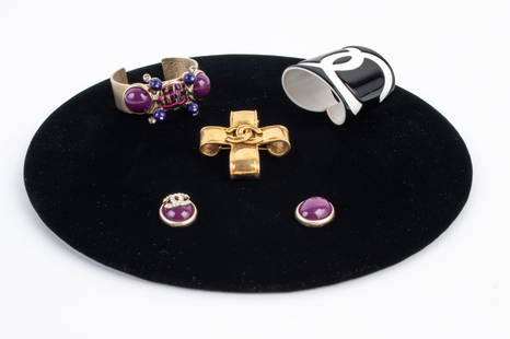 GROUPING OF VINTAGE CHANEL JEWELRY, AS-IS: Including: a rare Spring 1994 gold vermeil ribbon cross brooch with CC logo; Spring 2003 brushed goldtone cuff bracelet with tweed, purple resin stones and strass crystals; and a 2006 monochrome black