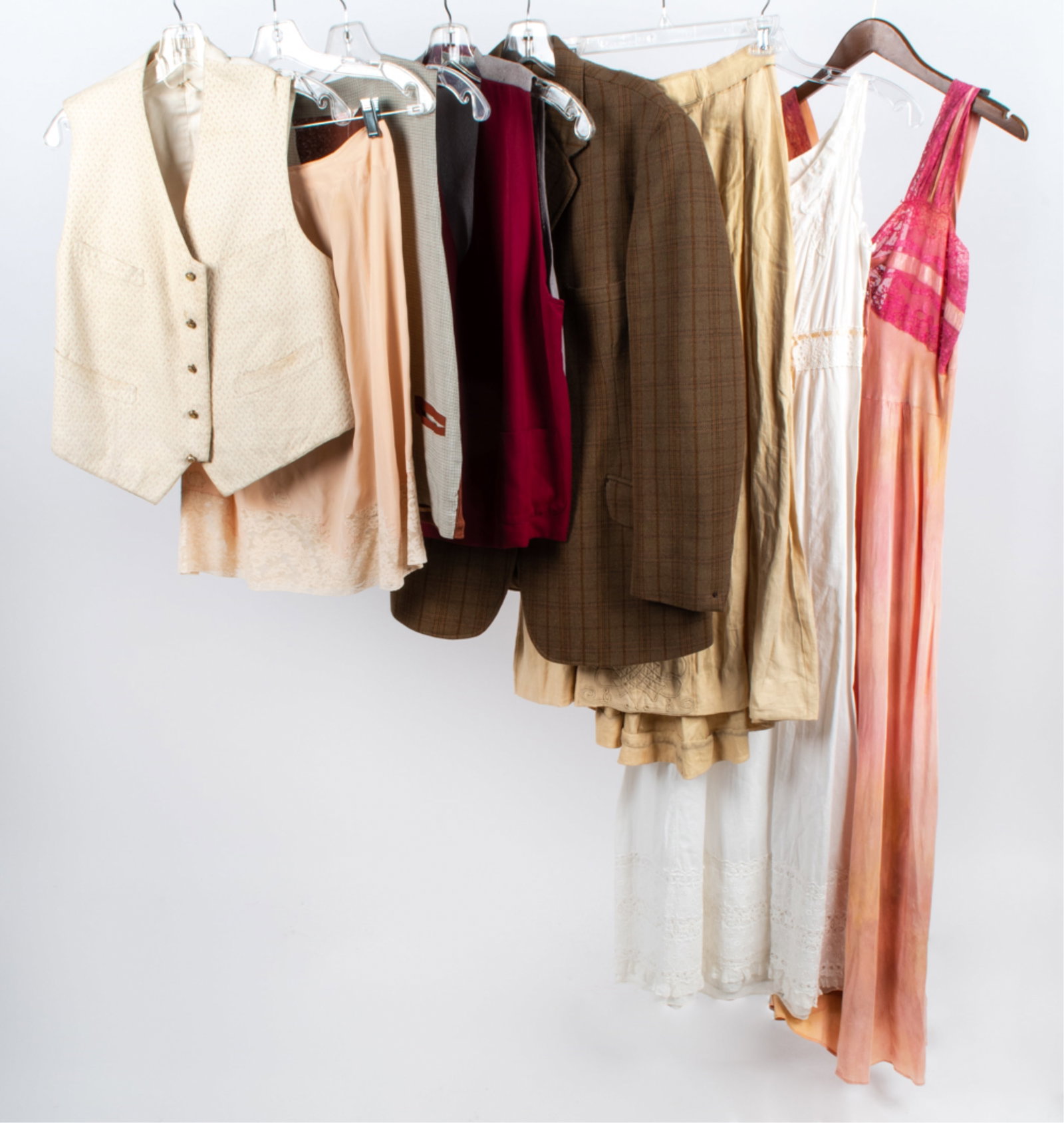 GROUPING OF VINTAGE CLOTHING, C. 1890'S-1970'S: (8) Pieces in total. Includes: Victorian white cotton and lace dress with pink ribbon, approx. waist size 25"; pink hand-dyed silk and lace full-length slip, approx. waist size 30"; and various others
