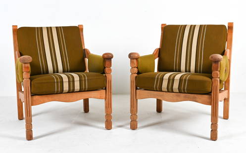 PAIR OF OAK ARMCHAIRS ATTR. TO HENNING KJAERNULF: Unusual and highly decorative pair of lounge chairs in white oak, with exposed slat backs and sculpted handrests supported by fluted stiles; finished in traditional olmer striped fabric. Attributed