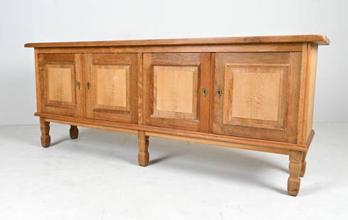 ATTR. HENNING KJAERNULF OAK SIDEBOARD: Dimensions: H 32.5" x W 80.25" x D 18.5" Condition: In excellent vintage condition overall. Minor sun fading to top; a few small water spots and finish rubs; overall light wear consistent with age.