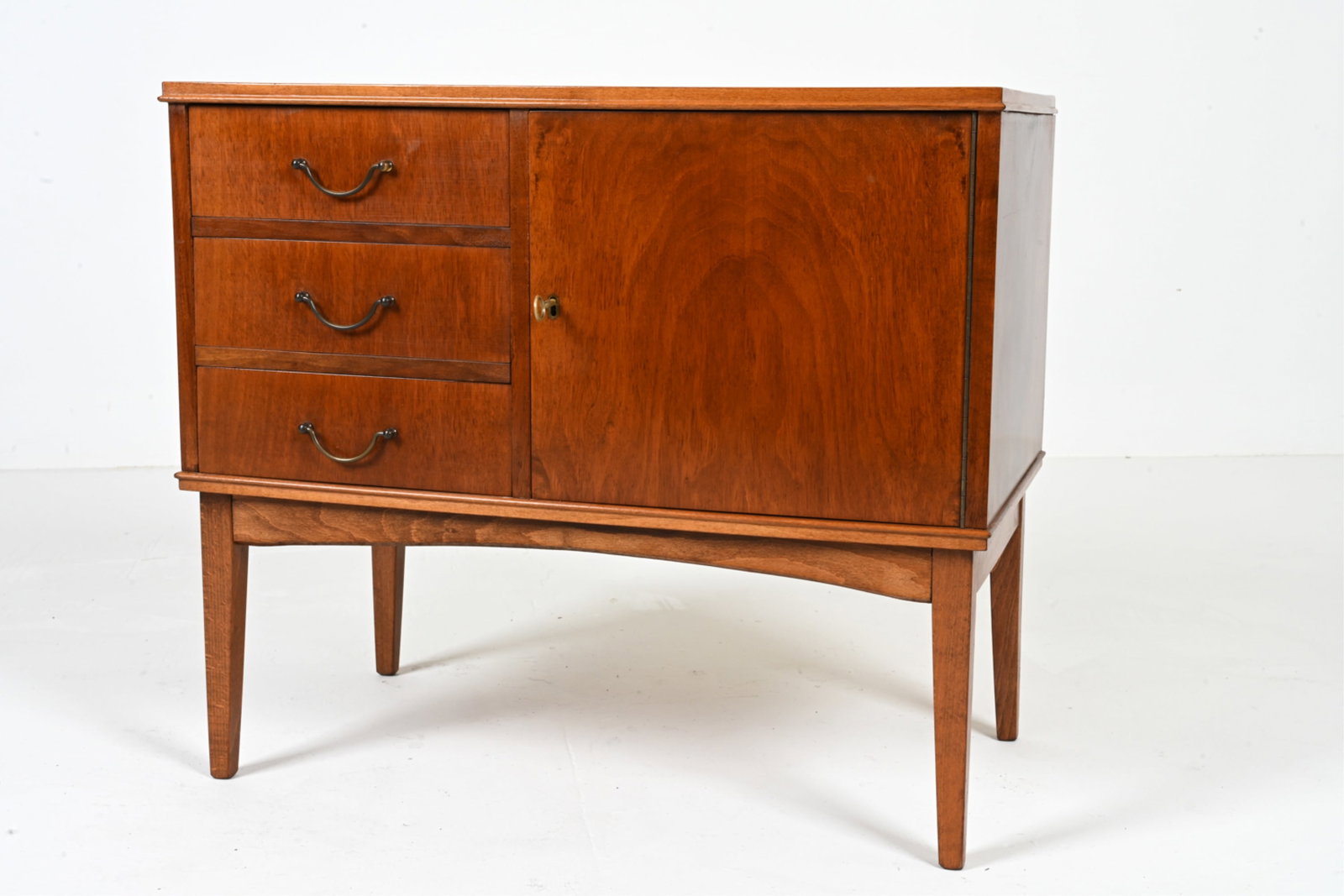 DANISH CABINETMAKER NUTWOOD CHEST, C. 1950'S: Key Included. Dovetailed drawers. Secondary woods appear to be beech and pine. Dimensions: H 24" x W 27.5" x D 15.75" Condition: Some minor scratches to top. Wire hole cut to backboard. E139