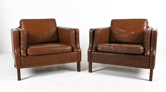 PAIR OF BORGE MOGENSEN-STYLE LEATHER CLUB CHAIRS: Scandinavian Modern lounge chairs in brown leather and dark stained beechwood, in the manner of Borge Mogensen; c. Late 20th Century. Dimensions: H 28" x W 32" x D 31.5" x SH 16" Condition: Patina and