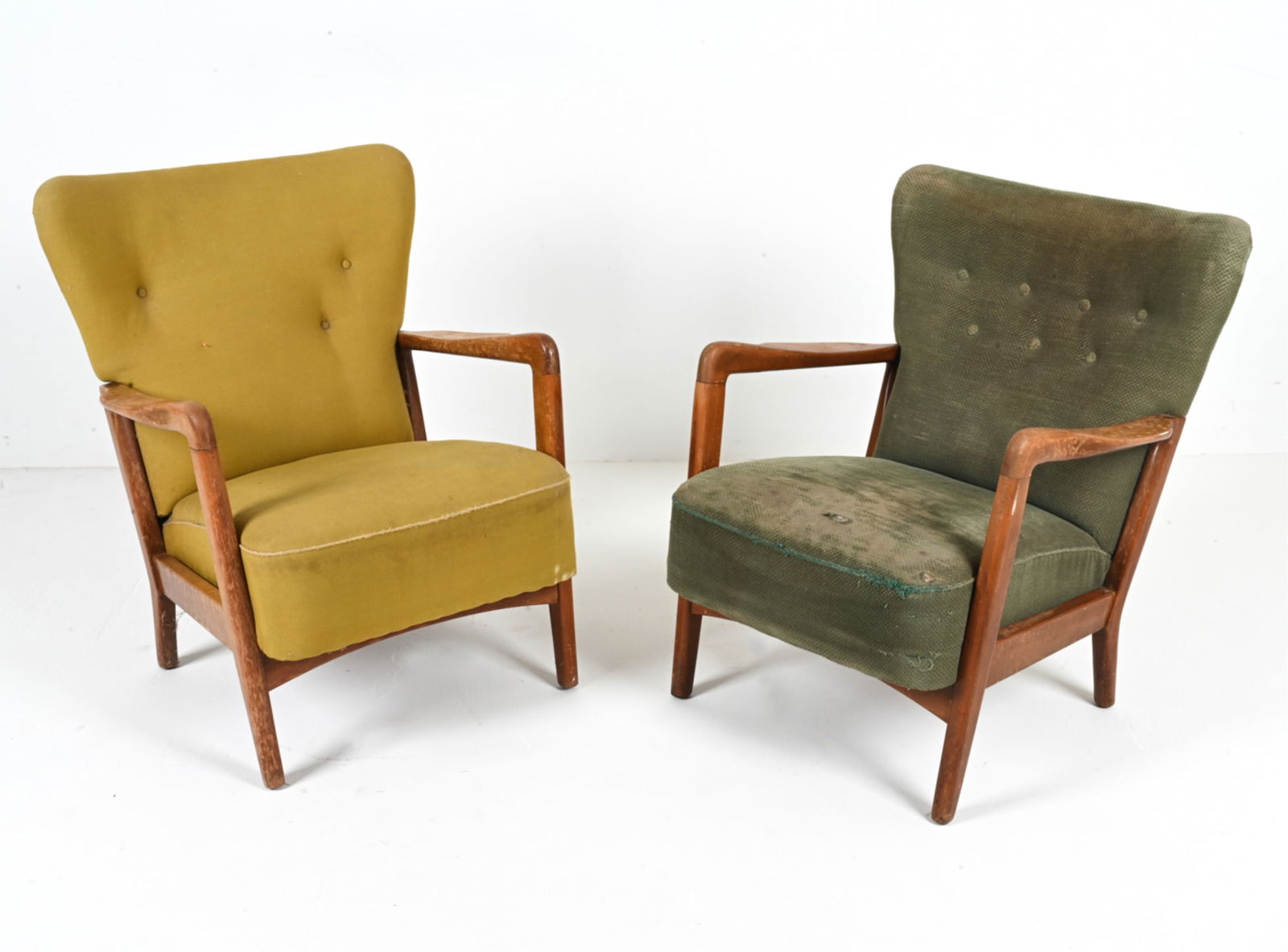 (2) SOREN HANSEN FOR FRITZ HANSEN EASY CHAIRS: With sculpted beech armrests, c. 1940's. Dimensions: (Taller) H 32" x W 26" x D 27.5" x SH 16" Condition: Great candidates for refinishing and reupholstering - both chairs showing dings, scuffs, rubs