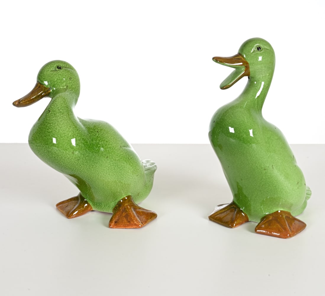PAIR OF ITALIAN MAJOLICA DUCKS: Made in Italy underneath. Dimensions: H 12" x W 6.5" x D 8" Condition: Small nick to one duck's foot; a few light rubs to paint on eyes. No signs of breaks or repairs.