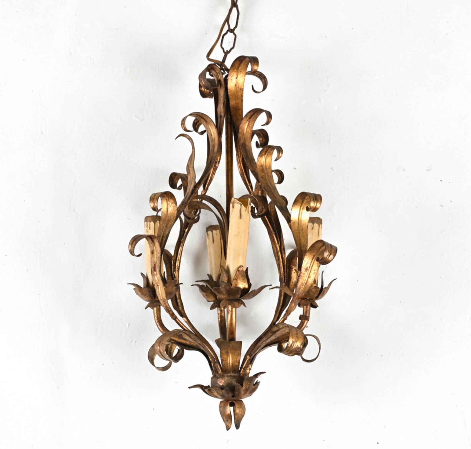 PETITE GILT TOLE METAL CHANDELIER: Dimensions: (Fixture) H 19" x Dia. 10" Condition: Wiring not tested. A few bends to metal; minor flaking and a few losses to gilt finish, some oxidation to exposed metal. Cracking and losses to socket