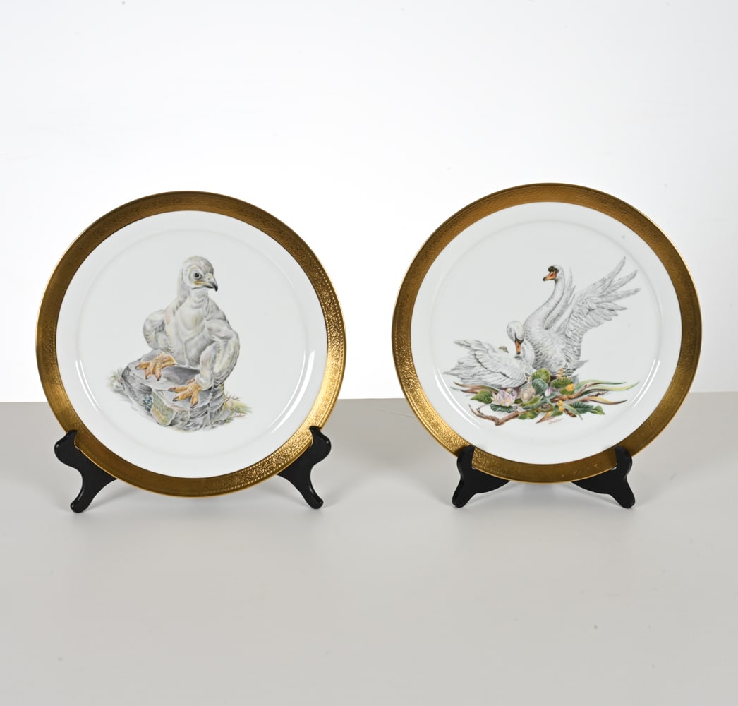 (2) EDWARD MARSHALL BOEHM PORCELAIN PLATES: "Mute Swans" and "American Eagle"; in original boxes. Dimensions: Dia. 12.75" Condition: Plates with no issues to note; no signs of chips, cracks, repairs, or losses. Some handling wear to boxes.