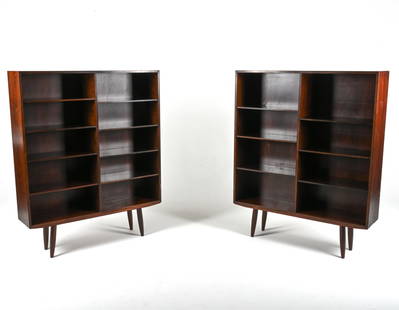 PAIR OF GUNNI OMANN NO. 6 BOOKCASES IN ROSEWOOD: (2) Danish Mid-Century Model No. 6 large bookcases in luxurious rosewood, designed by Gunni Omann for Omann Jun, c. 1960's. Dimensions: H 58.75" x W 47.25" x D 11.5" Condition: Light sun fading, a few