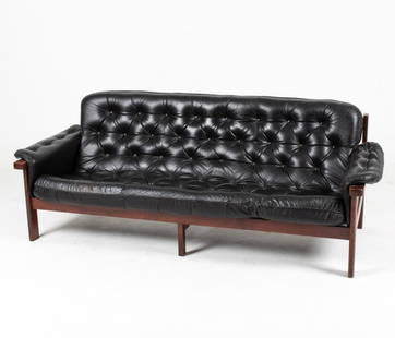 MANNER OF PERCIVAL LAFER ROSEWOOD & LEATHER SOFA: Rosewood and tufted leather sofa in the manner of Percival Lafer, c. 1970's. Dimensions: H 29" x W 76.5" x D 33.25" x SH 15.5" Condition: Some wear to leather. Minor scuffs throughout. Wear consistent