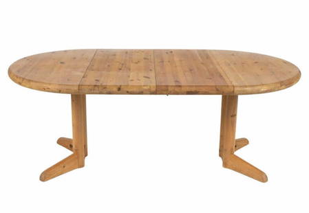 RAINER DAUMILLER PINE EXTENSION DINING TABLE: c. 1970's. Including (2) 18" leaves. Dimensions: (Without leaves) H 30" x Dia. 43" Condition: Wear consistent with age and use. PA002