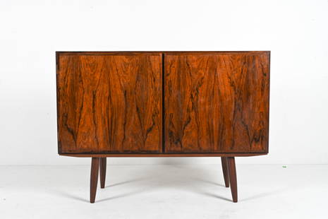 OMANN JUN ROSEWOOD SIDEBOARD CABINET, C. 1960'S: Danish Mid-Century sideboard or bar cabinet in richly figured rosewood, featuring minimalist lines and classic tapered legs. Produced by Omann Jun Mobelfabrik, c. 1960's. Dimensions: H 34" x W 47" x D