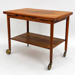 MOGENS HANSEN DANISH MID-CENTURY TEAK BAR CART: Danish Mid-Century teak extendable rolling serving or bar cart manufactured by Svendborg Mobler and designed by Mogens Hansen, Denmark circa 1960s. Branded manufactures mark under bottom shelf: MH Mob