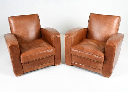 PAIR OF 20TH C. ART DECO-STYLE LEATHER CLUB CHAIRS: In the manner of Jacques Adnet, c. Mid- to Late 20th Century. Dimensions: H 31" x W 32.5" x D 34" x SH 16" Condition: Rich natural patina to leather. Light surface wear consistent with age and use; a