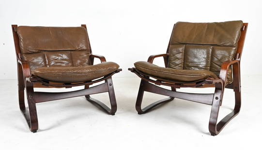 PAIR OF GISKE CARLSEN FOR KLEPPE LOUNGE CHAIRS: Rare pair of Norwegian Modern lounge chairs in bent beech wood finished in dark rosewood-mahogany stain, with olive brown-green buffalo leather cushions. Designed by Giske Carlsen for Kleppe Mobelfabr
