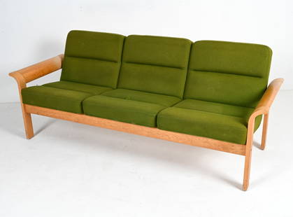 THYGESEN & SORENSEN FOR MAGNUS OLESEN SOFA: Danish Modern three-seat sofa in oak veneer over molded plywood, designed by Rud Thygesen and Johnny Sorensen for Magnus Olesen, c. 1970's. Dimensions: H 29" x W 74" x D 29" x SH 17" Condition: Great